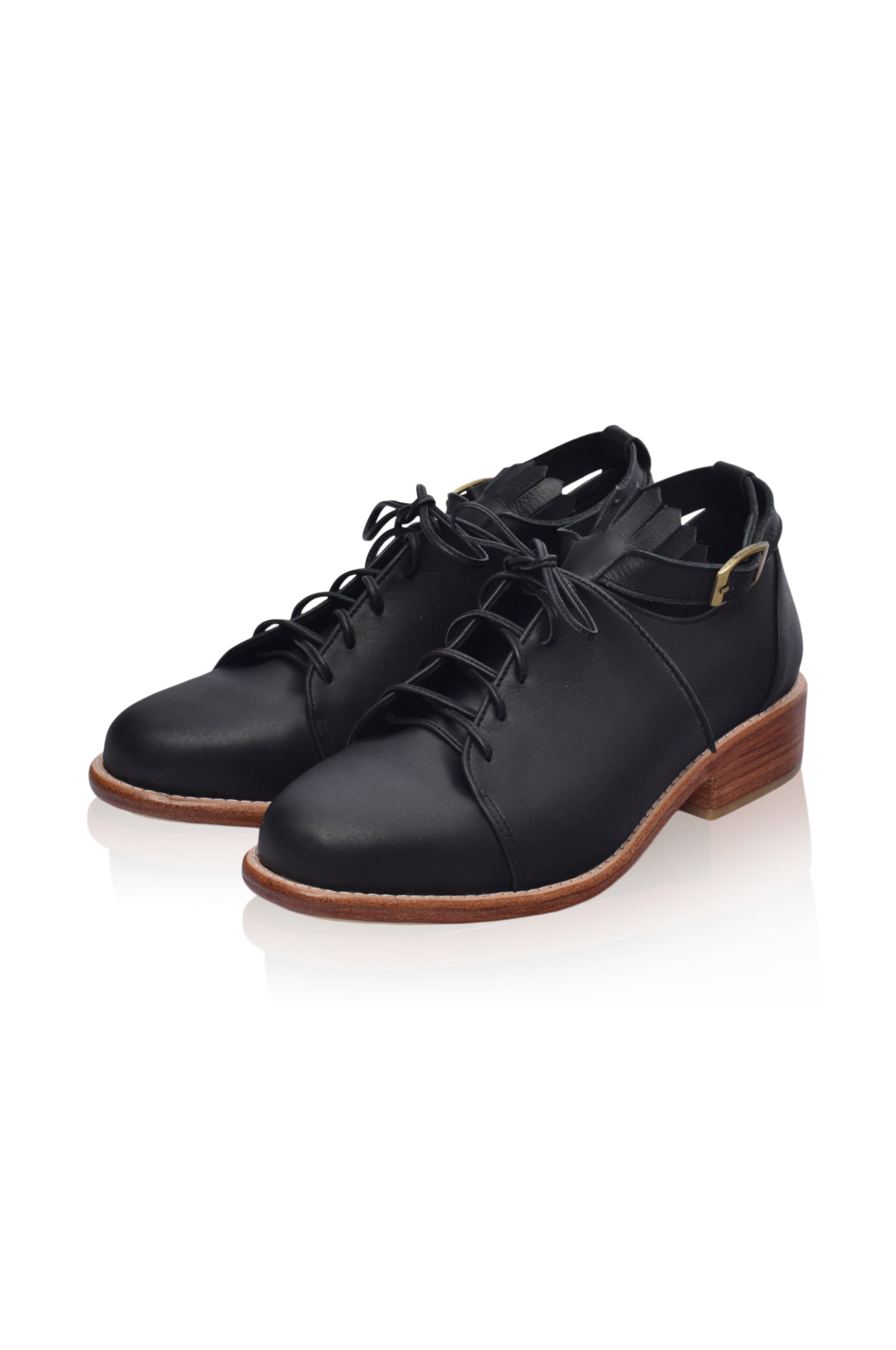 A pair of stylish Boston Leather Oxfords featuring fringe detailing and an ankle strap, showcasing their elegant design and genuine leather material.