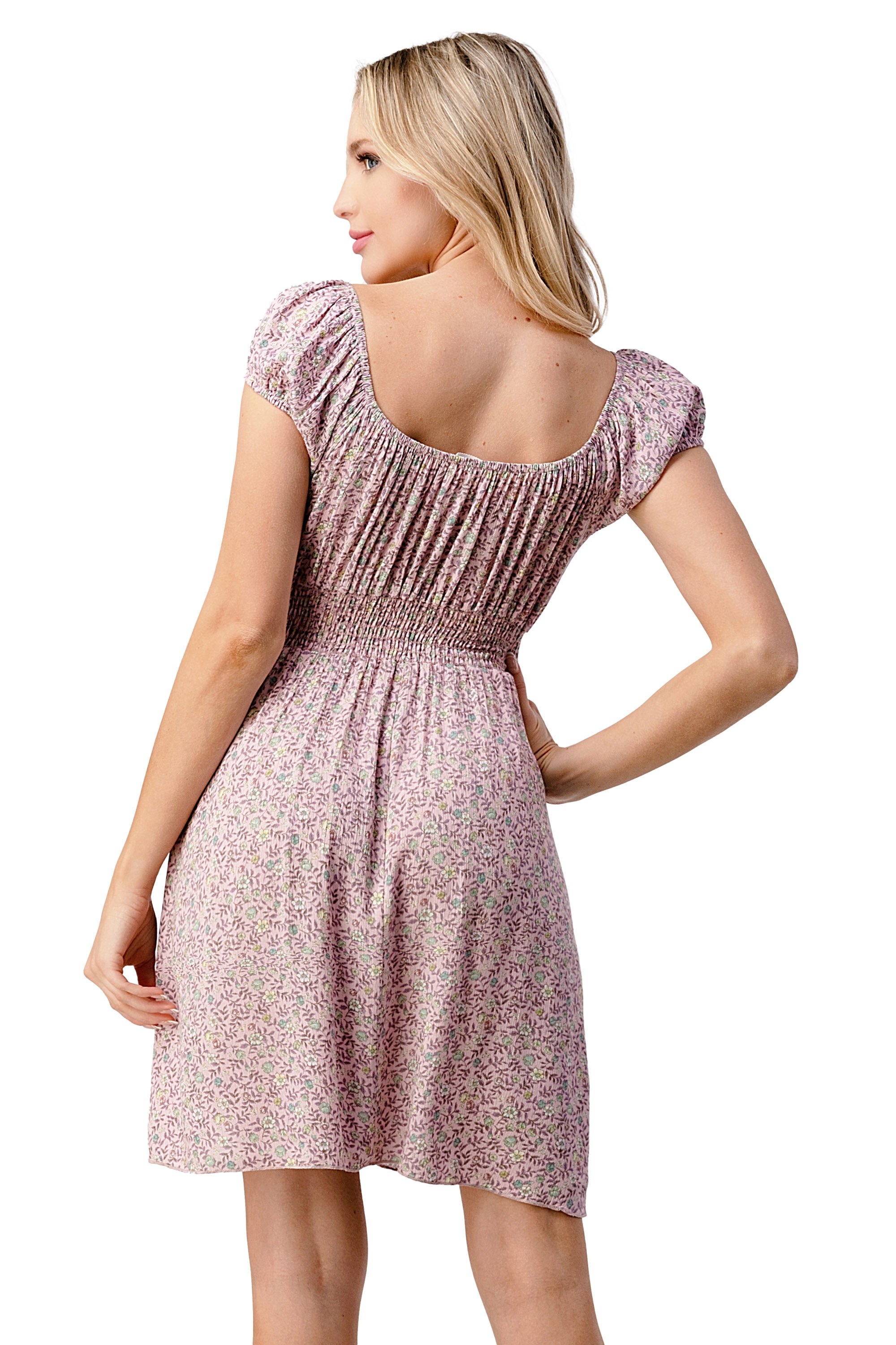 Emma dress featuring a bow tie front and cap sleeves in a daisy floral print, made from lightweight rayon gauze.