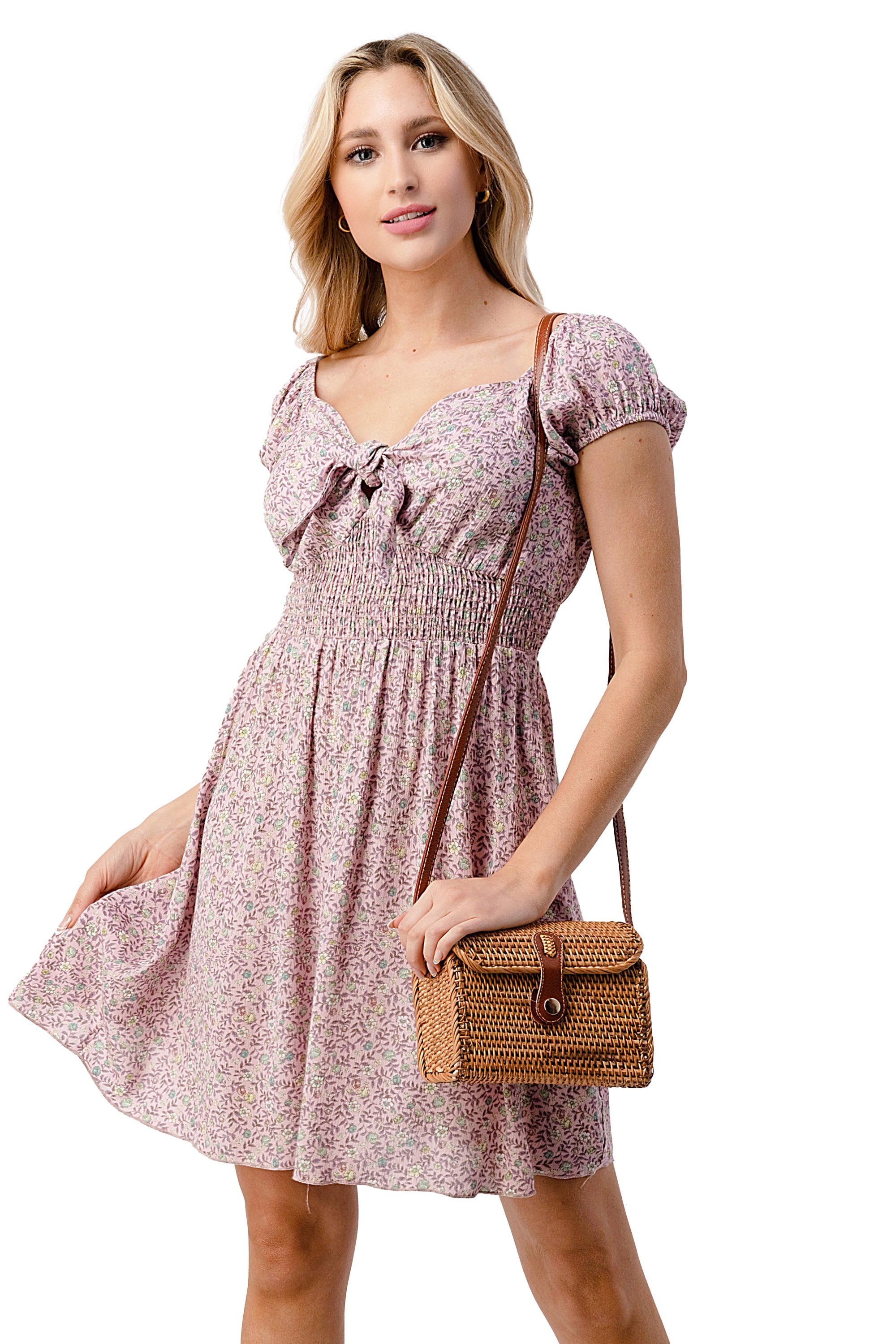 Emma dress featuring a bow tie front and cap sleeves in a daisy floral print, made from lightweight rayon gauze.