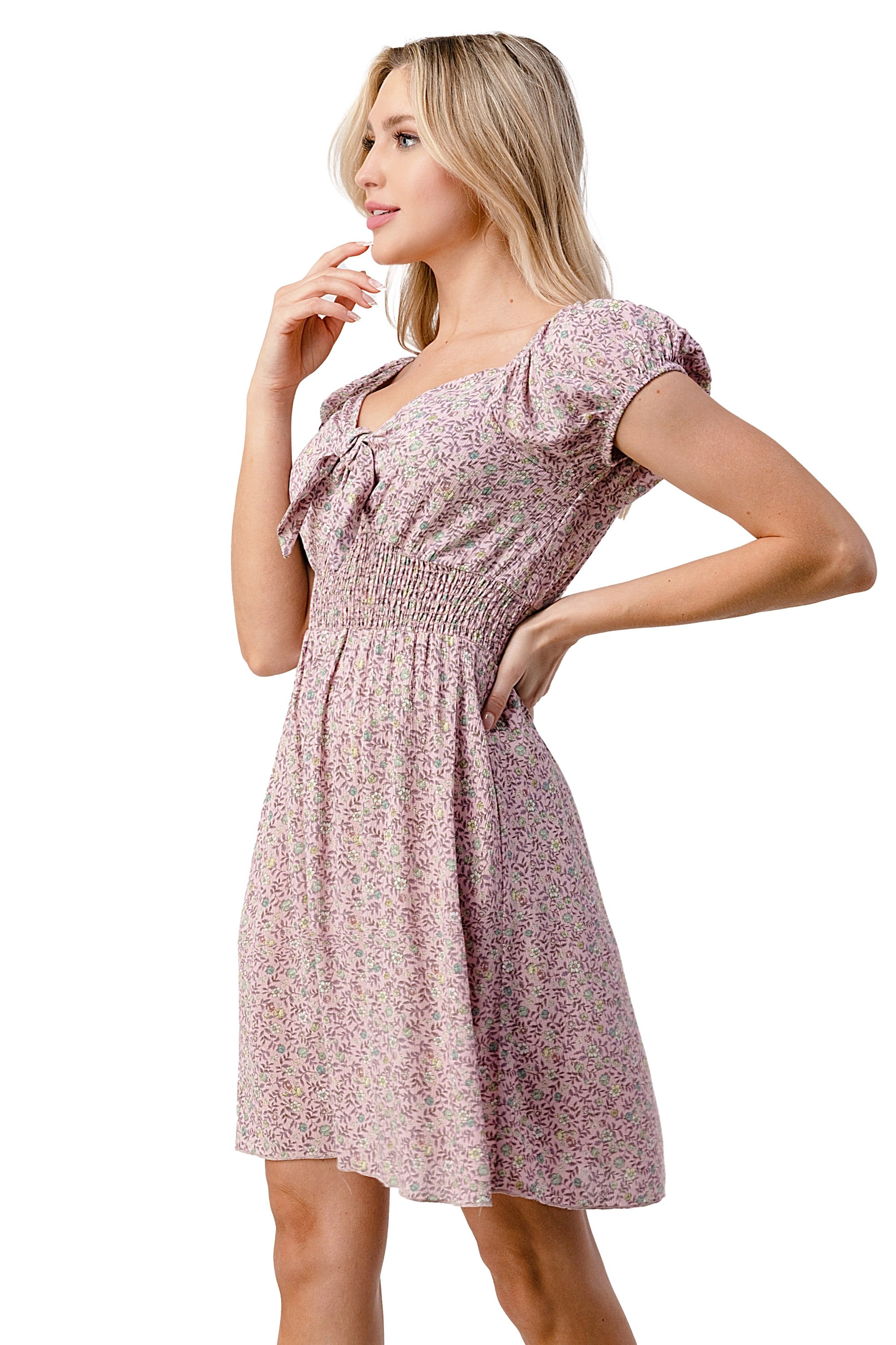Emma dress featuring a bow tie front and cap sleeves in a daisy floral print, made from lightweight rayon gauze.