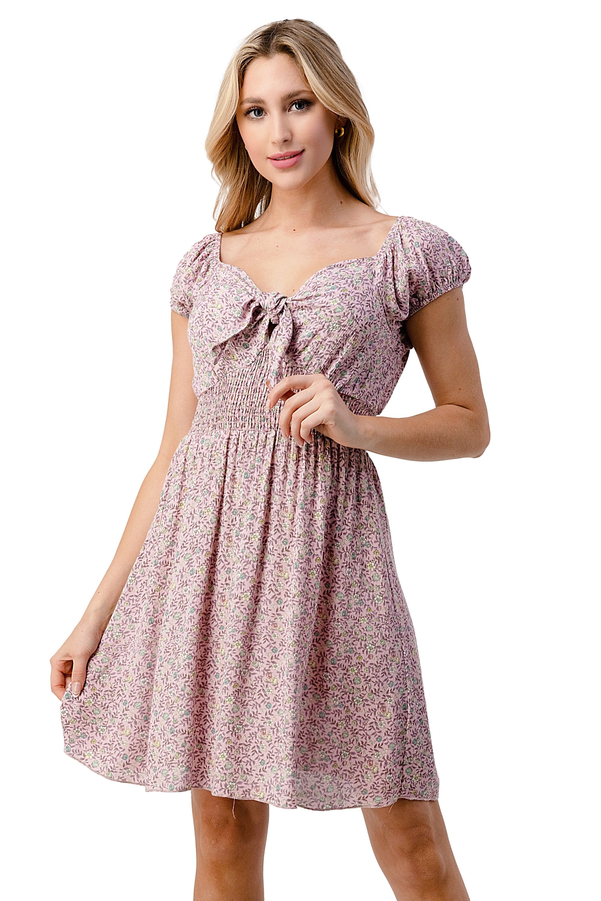 Emma dress featuring a bow tie front and cap sleeves in a daisy floral print, made from lightweight rayon gauze.