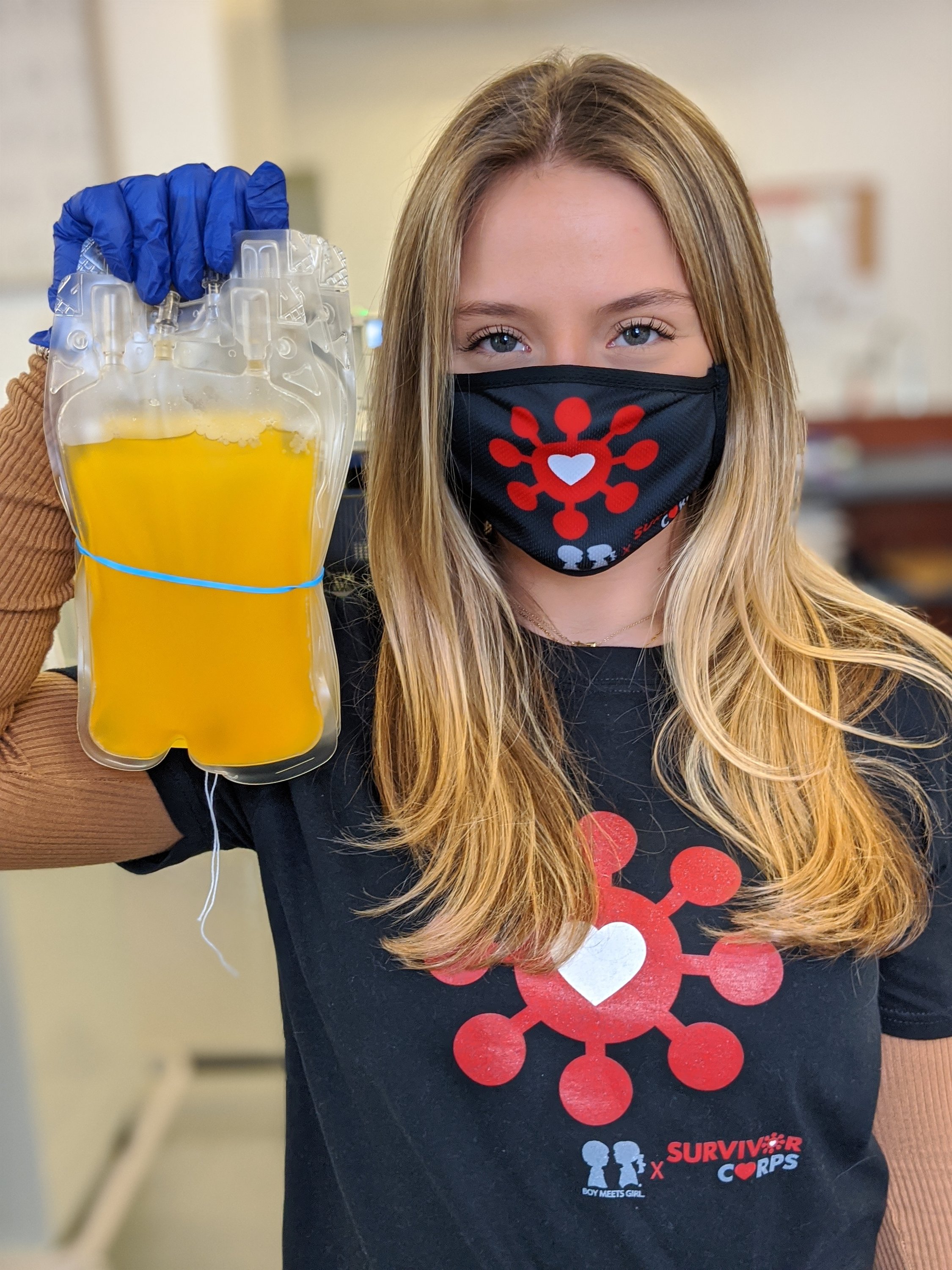 Black unisex t-shirt featuring BOY MEETS GIRL® x SURVIVOR CORPS logo, symbolizing support for COVID-19 survivors.