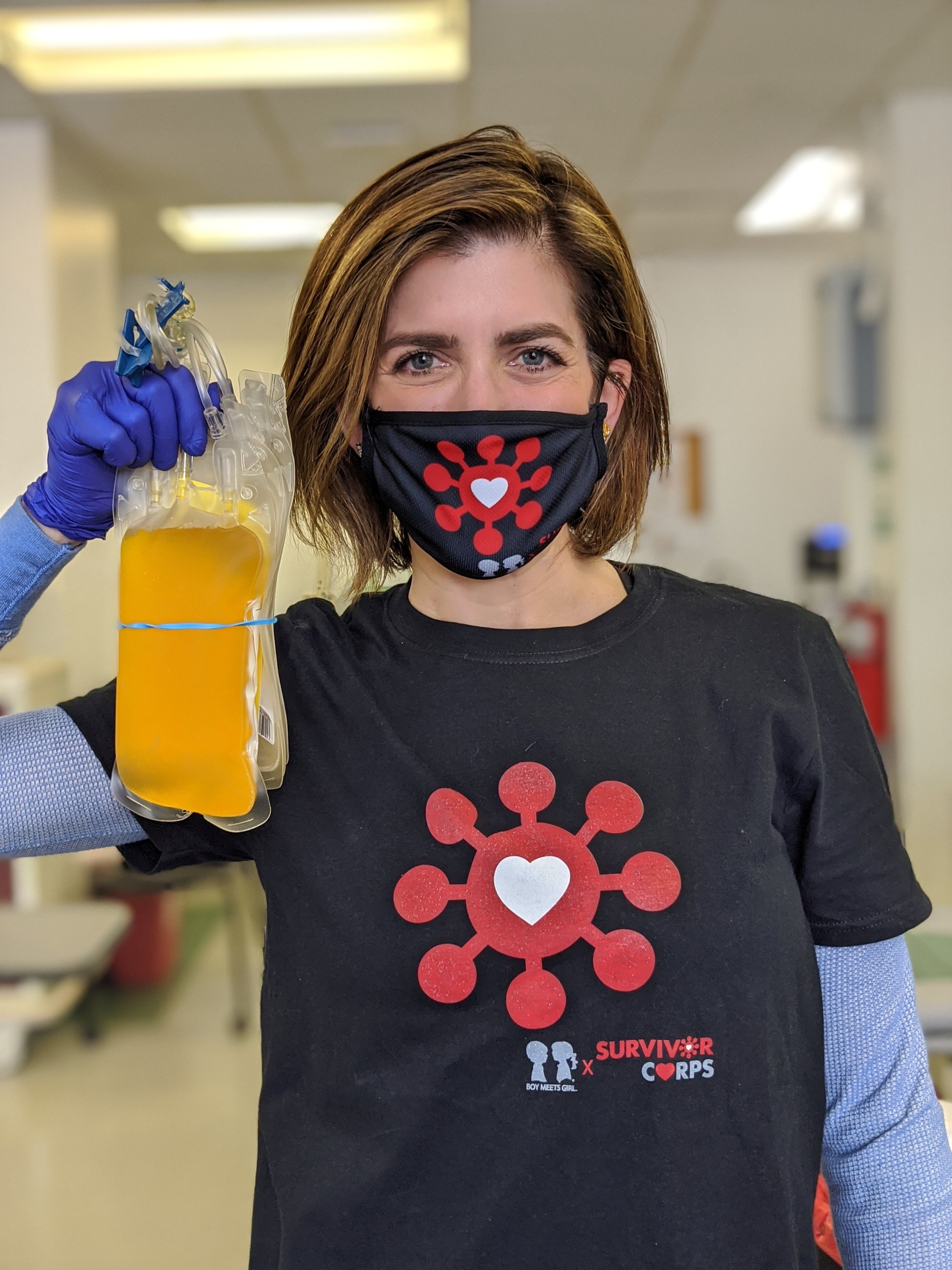 Black unisex t-shirt featuring BOY MEETS GIRL® x SURVIVOR CORPS logo, symbolizing support for COVID-19 survivors.