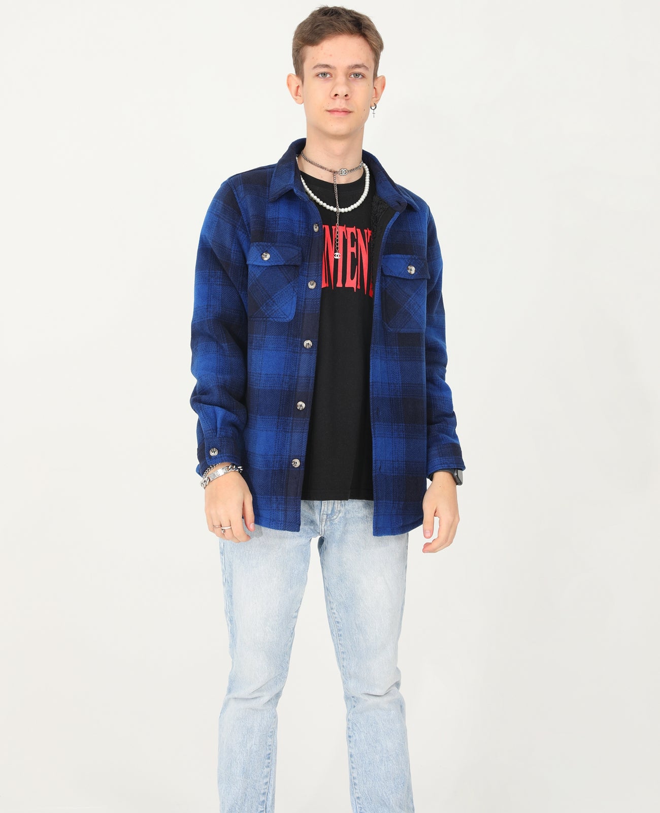 Boys Sherpa Lined Buffalo Plaid Fleece Button Down Shirt Jacket in a cozy setting, showcasing its stylish plaid pattern and soft fleece lining.