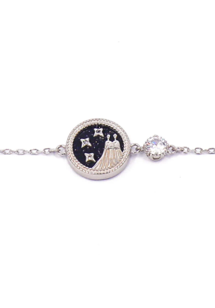 Elegant silver bracelet featuring a Gemini horoscope sign pendant, showcasing its intricate design and polished finish.