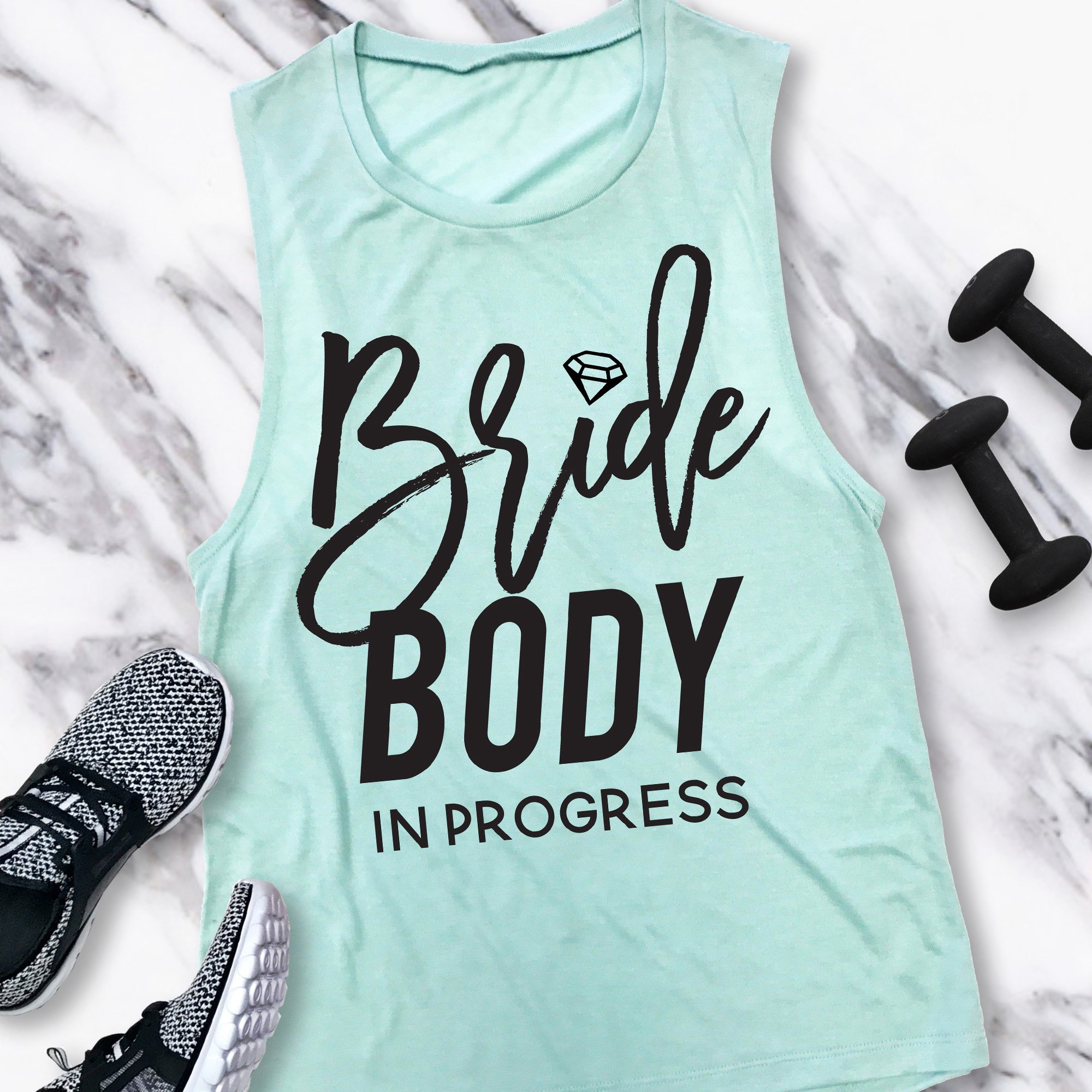 BRIDE BODY In Progress Muscle Tank in Dusty Blue and Peach colors, showcasing a motivational design for brides-to-be.