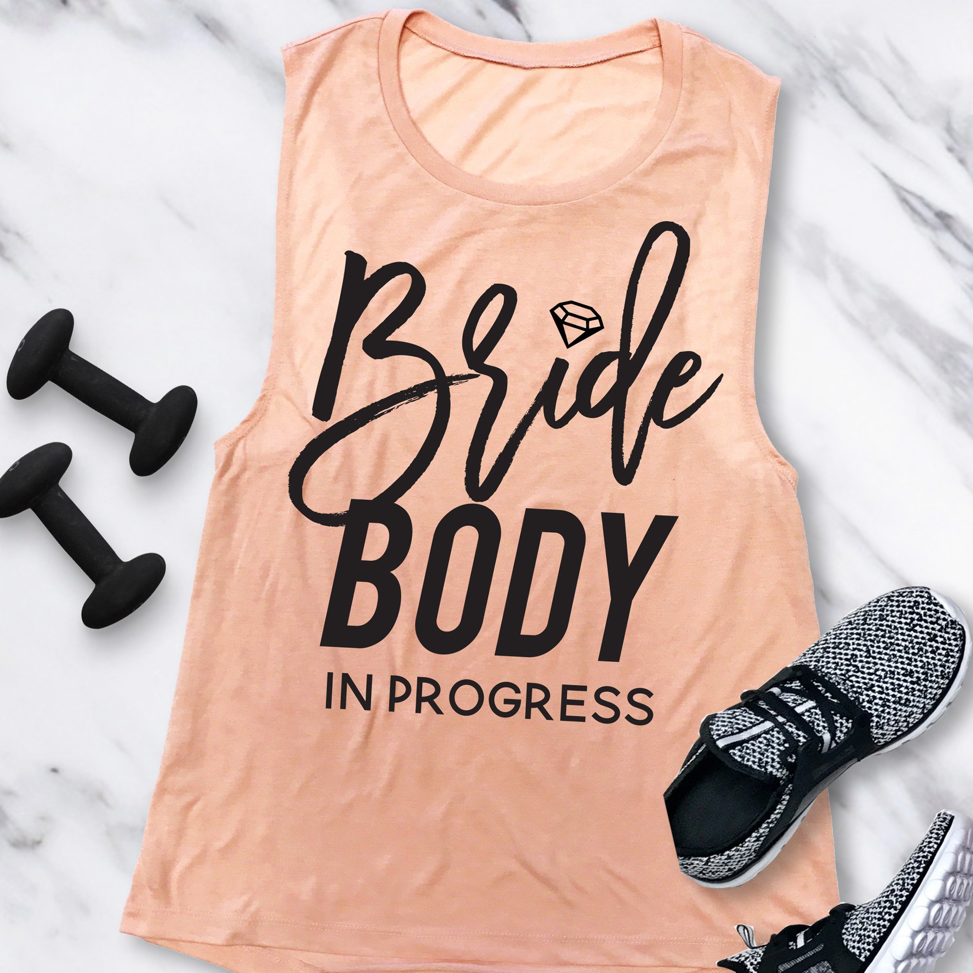 BRIDE BODY In Progress Muscle Tank in Dusty Blue and Peach colors, showcasing a motivational design for brides-to-be.