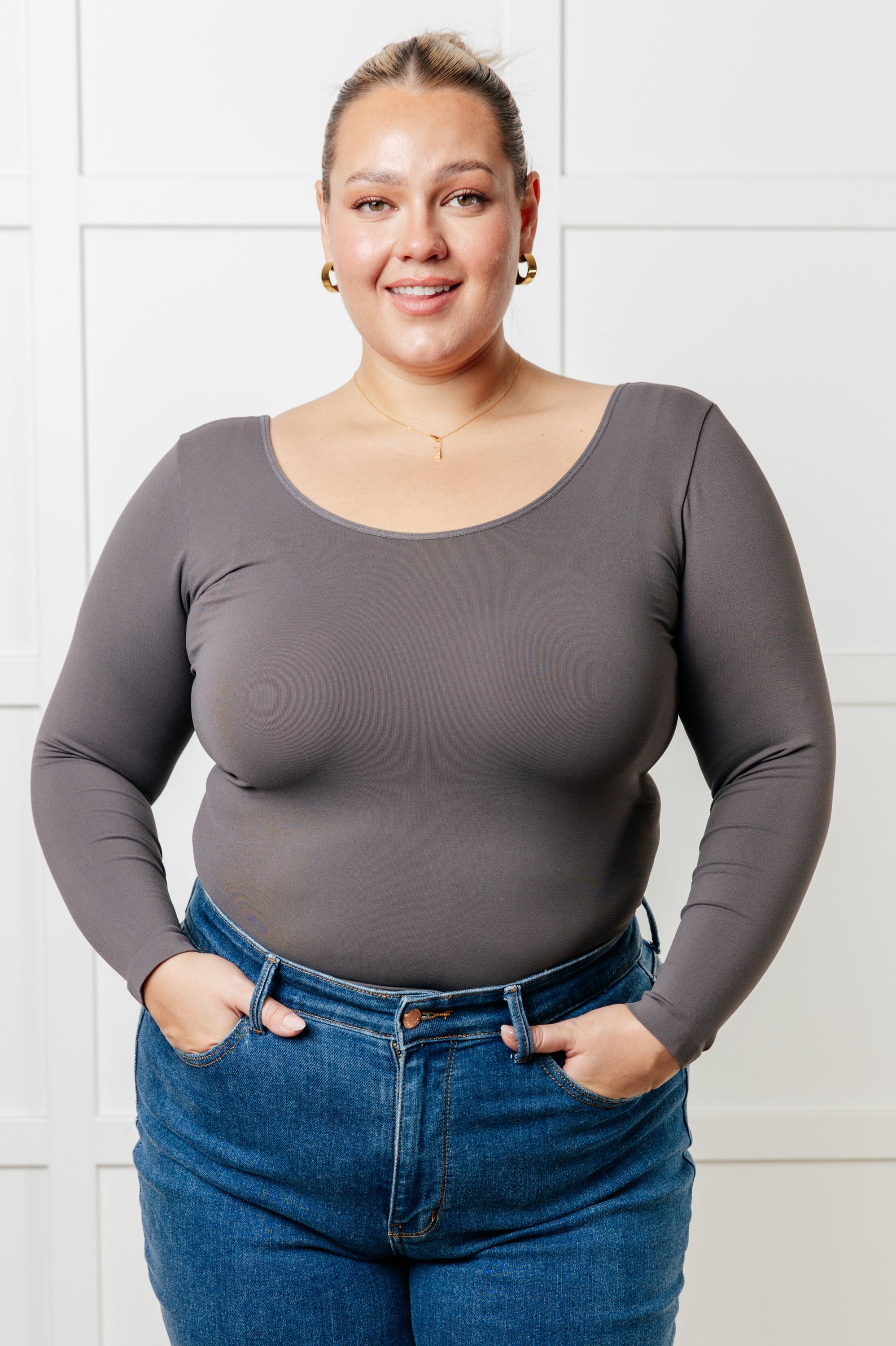 A seamless reversible V-neck top in charcoal, showcasing its soft brushed microfiber fabric and versatile scoop/V-neckline.