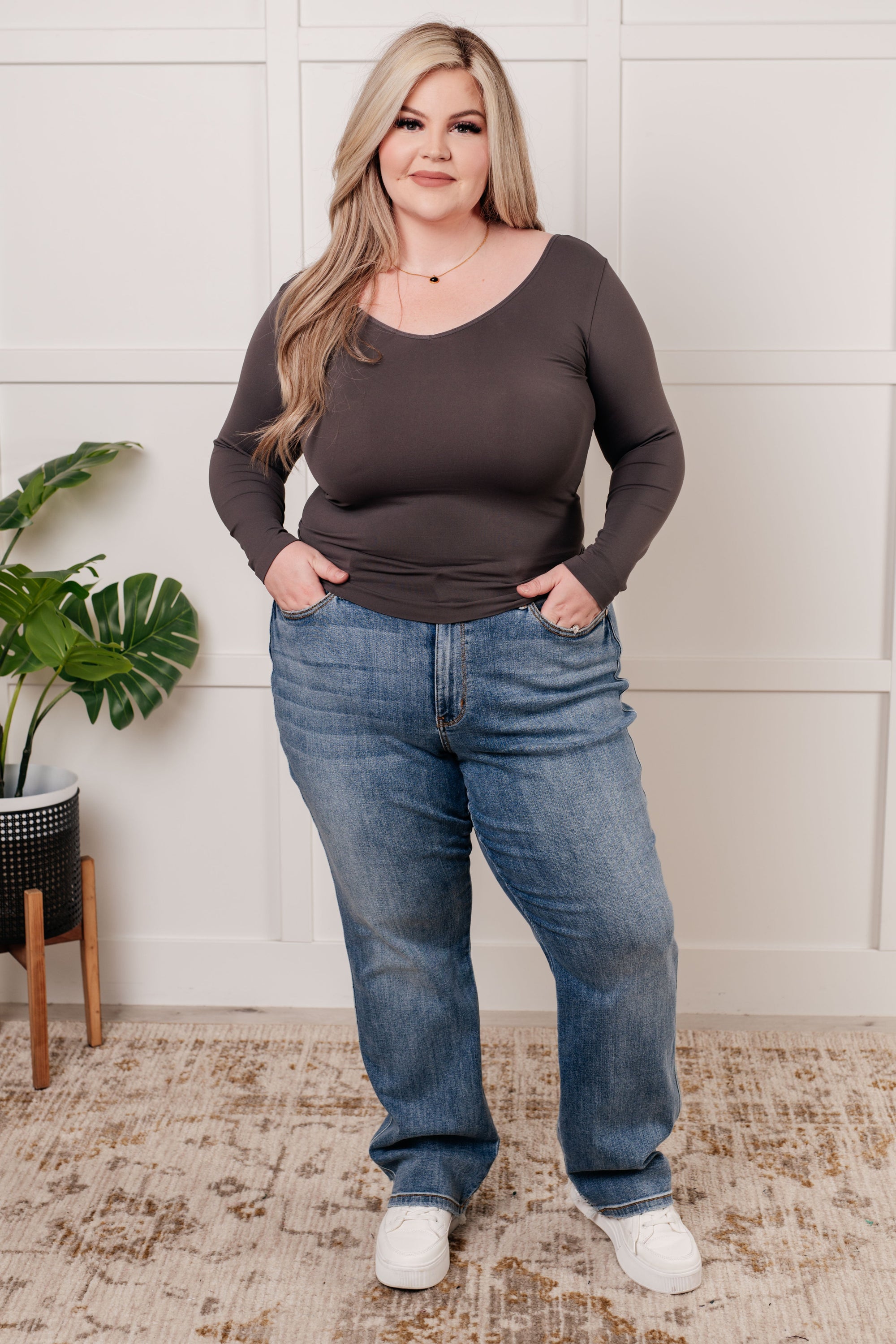 A seamless reversible V-neck top in charcoal, showcasing its soft brushed microfiber fabric and versatile scoop/V-neckline.