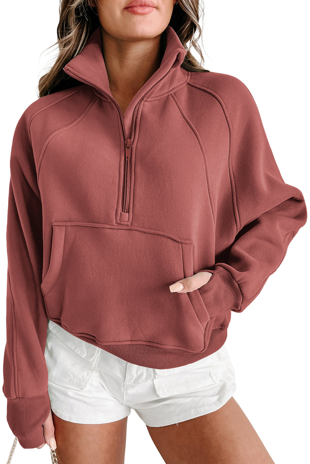 Brown zip-up sweatshirt with stand collar and thumbhole sleeves, featuring a textured design and kangaroo pocket.