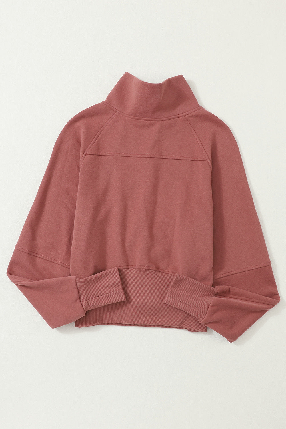 Brown zip-up sweatshirt with stand collar and thumbhole sleeves, featuring a textured design and kangaroo pocket.