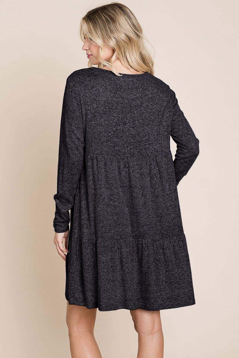 Brushed Hacci Tiered Pleated Mini Dress featuring long sleeves, a round neck, and a knee-length ruffled hem, perfect for various occasions.