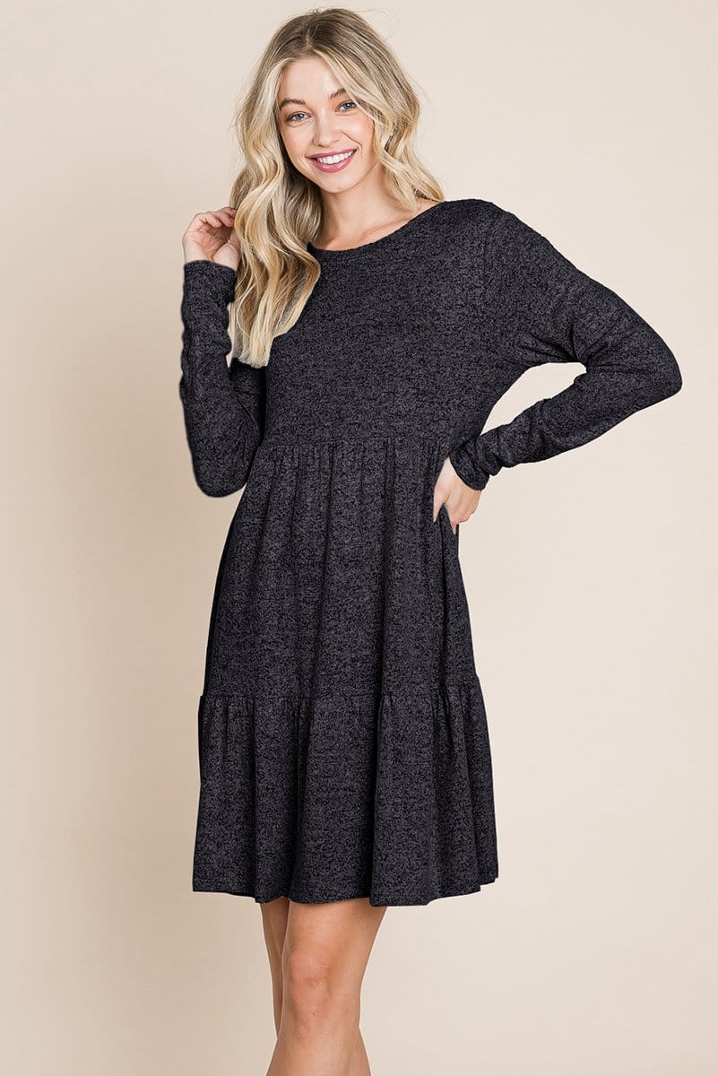 Brushed Hacci Tiered Pleated Mini Dress featuring long sleeves, a round neck, and a knee-length ruffled hem, perfect for various occasions.