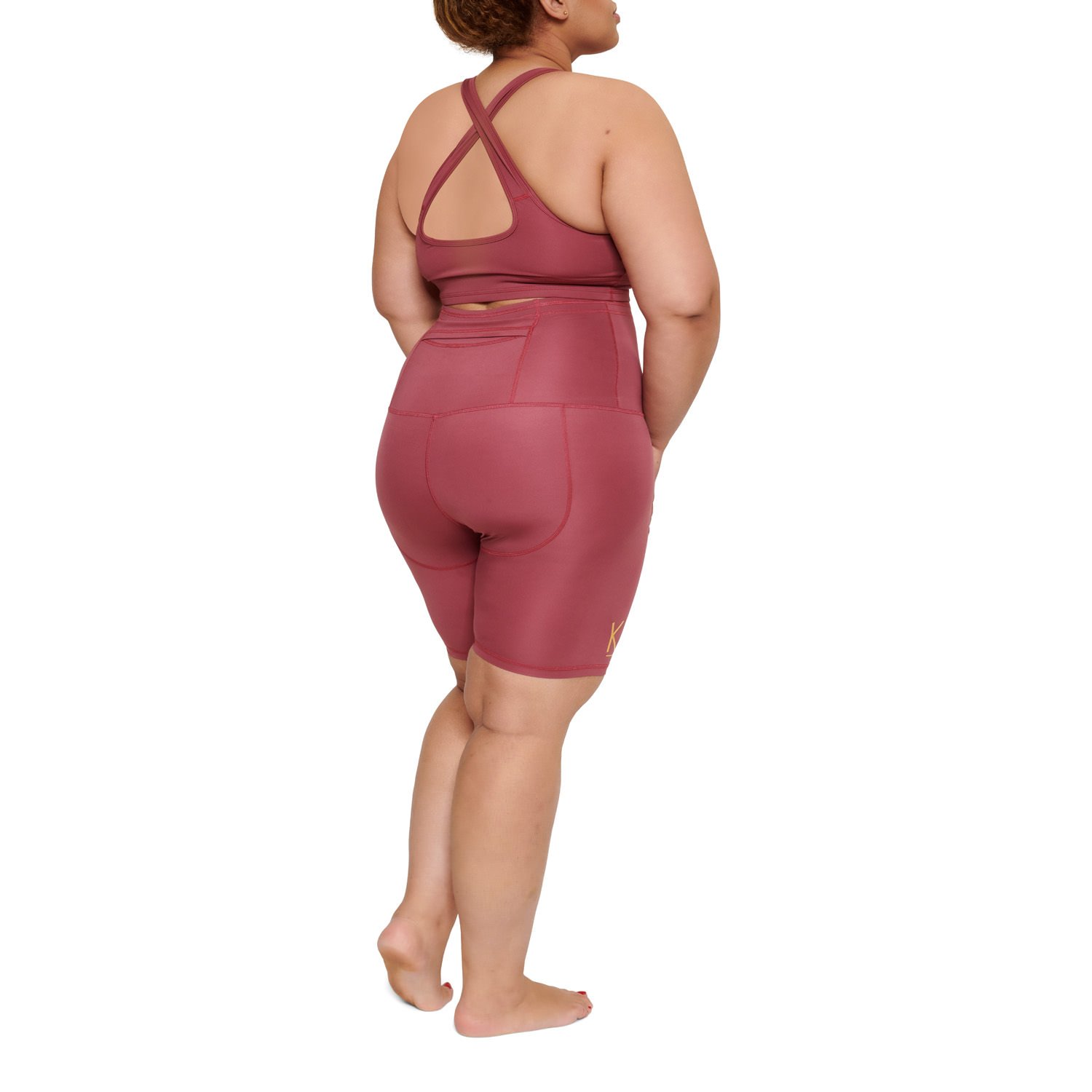 A pair of vibrant Bubblegum Cupcake Shorts showcasing a high-waisted design and a back pocket, perfect for workouts.