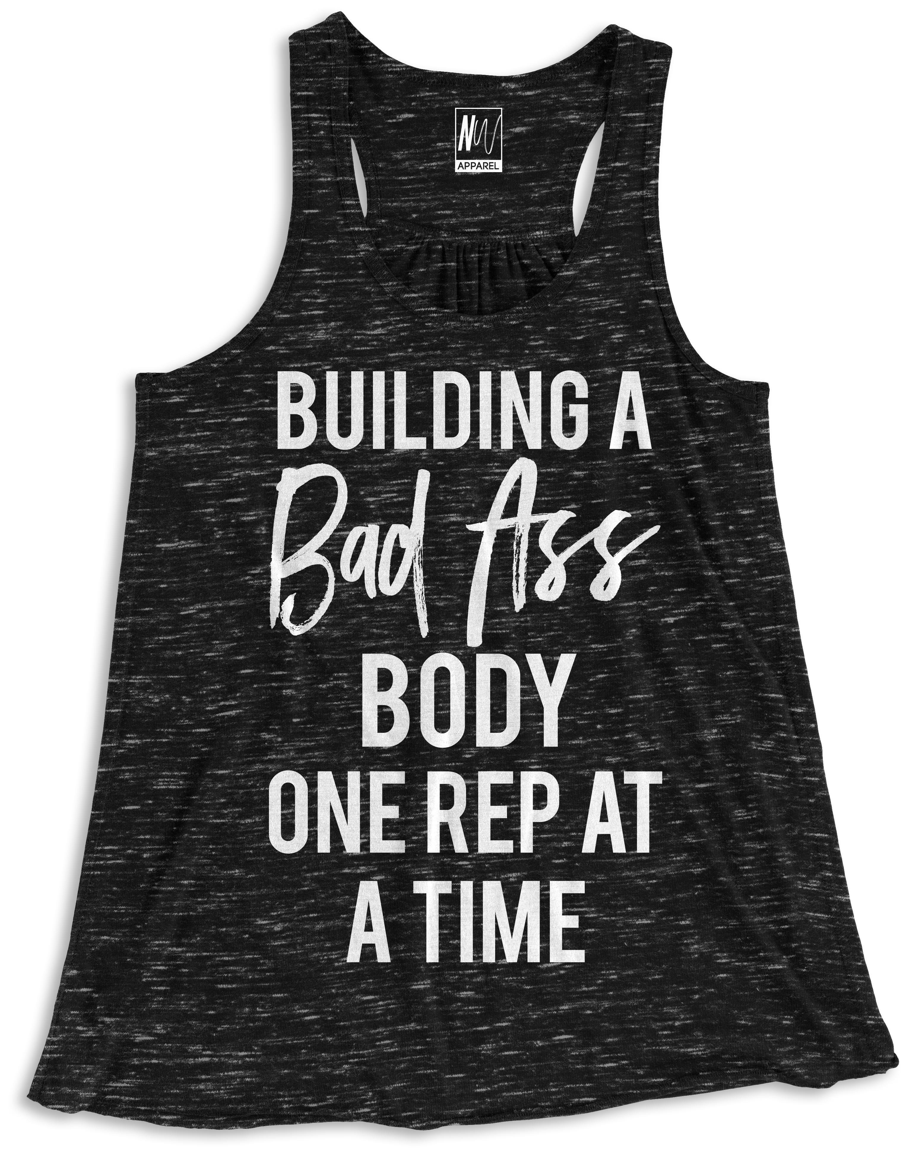 Black marble tank top featuring the phrase 'BUILDING A BAD ASS BODY ONE REP AT A TIME' for women, perfect for workouts.