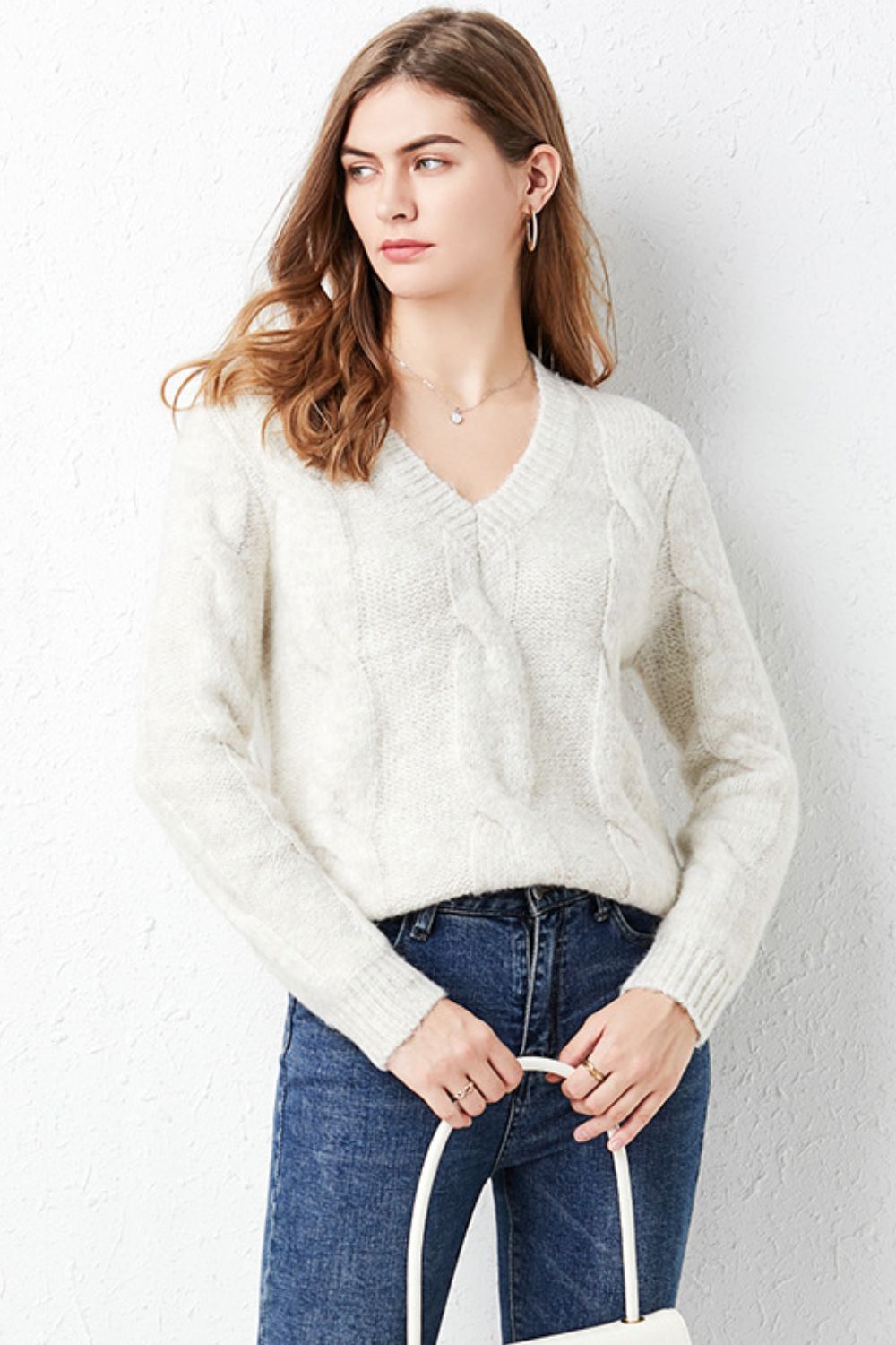 A cozy Cable-Knit Ribbed Trim V-Neck Pullover Sweater in a solid color, featuring long sleeves and a stylish ribbed design.