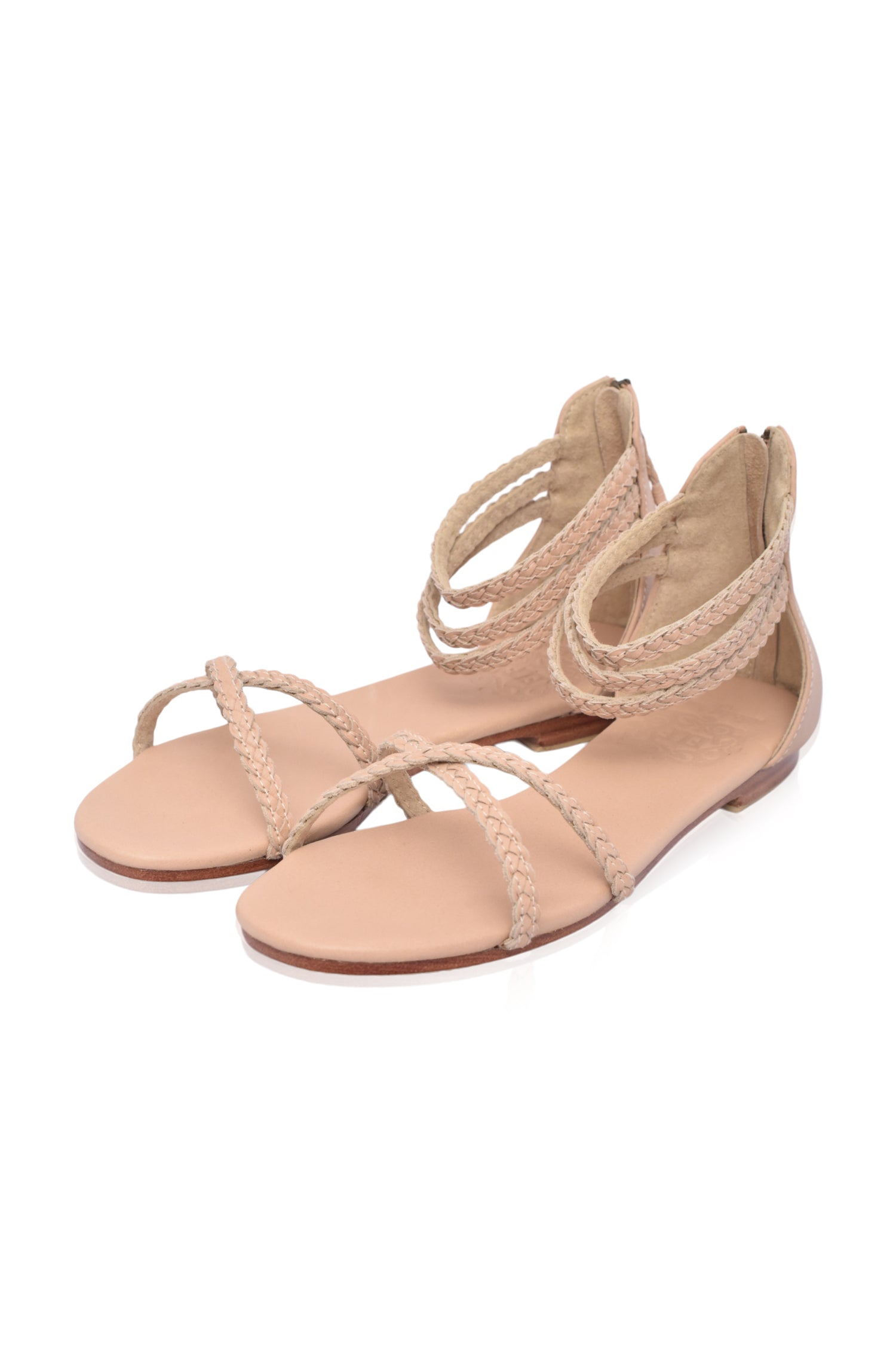 Calypso Braided Leather Sandals featuring braided leather straps, zipper closure, and open toe design, perfect for summer wear.