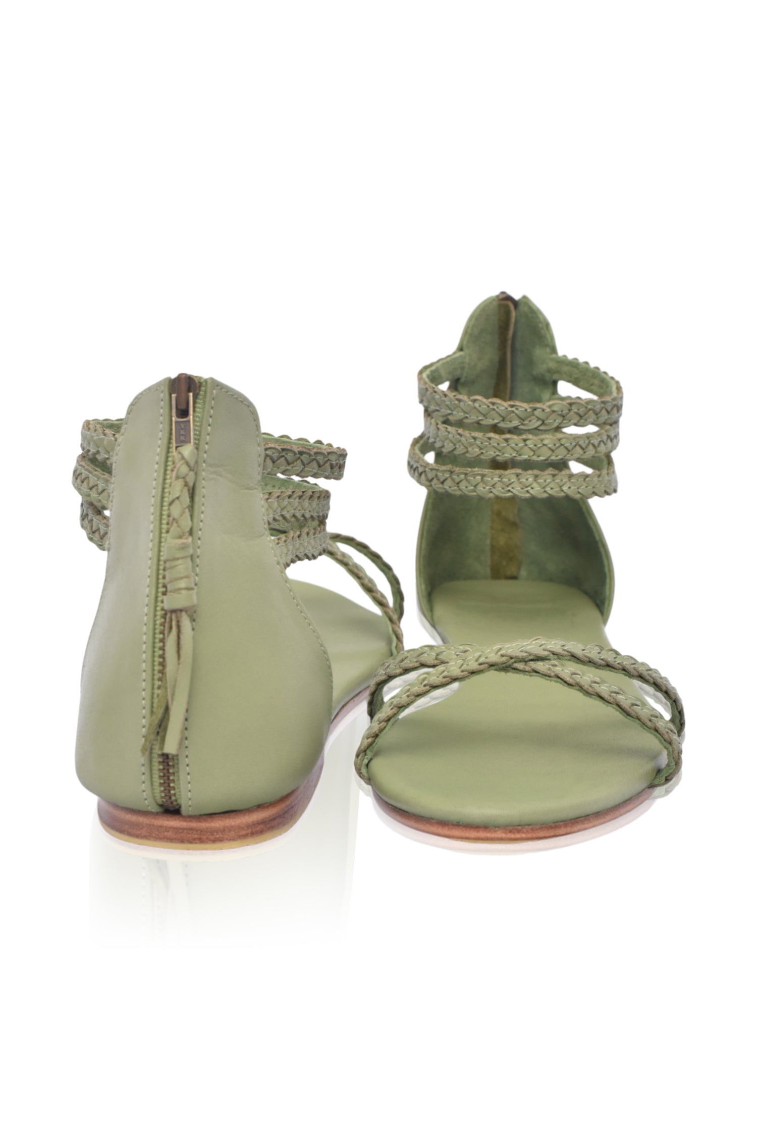 Calypso Braided Leather Sandals featuring braided leather straps and a back zipper for easy wear.