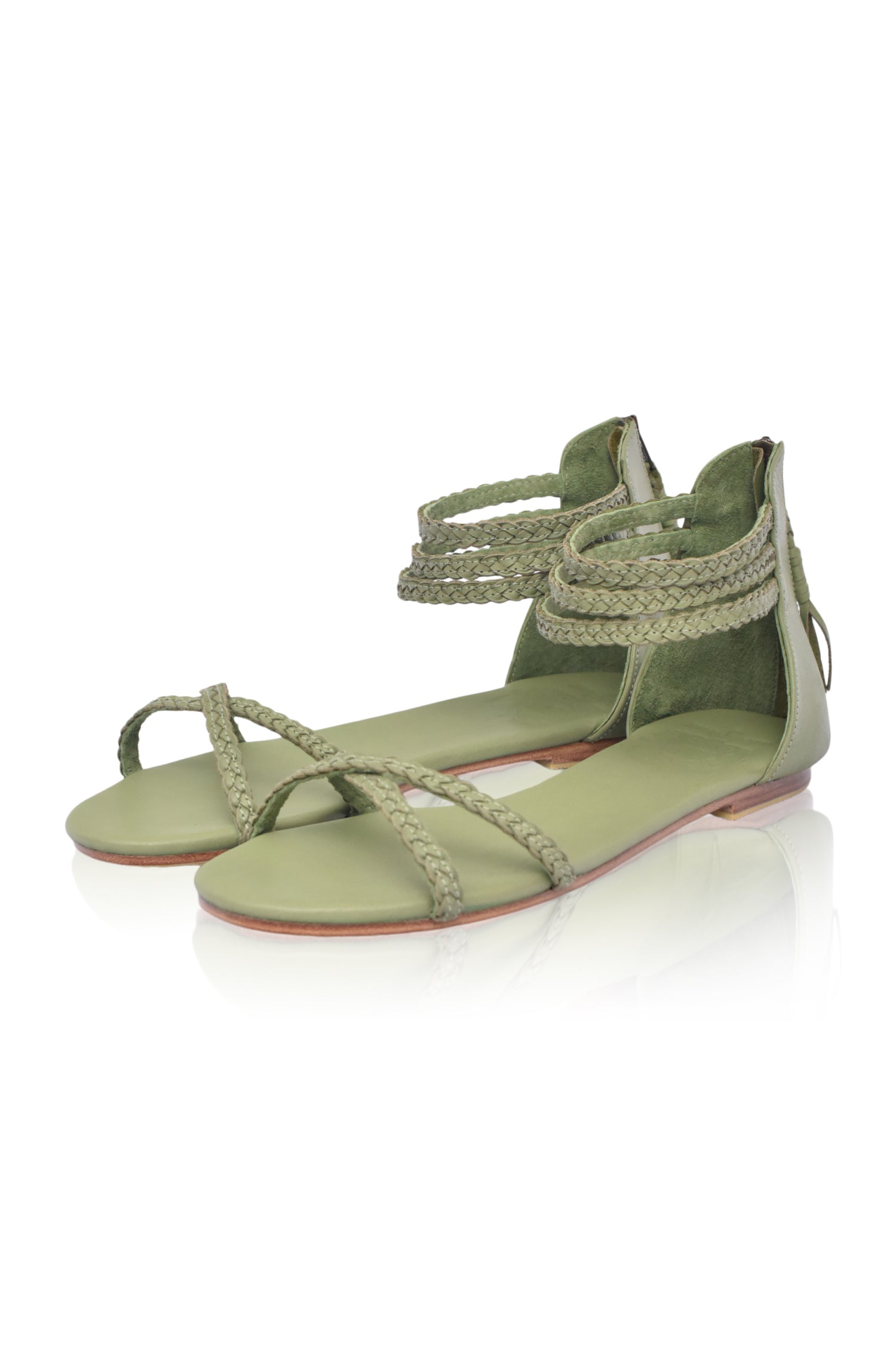Calypso Braided Leather Sandals featuring braided leather straps and a zipper closure, perfect for summer wear.