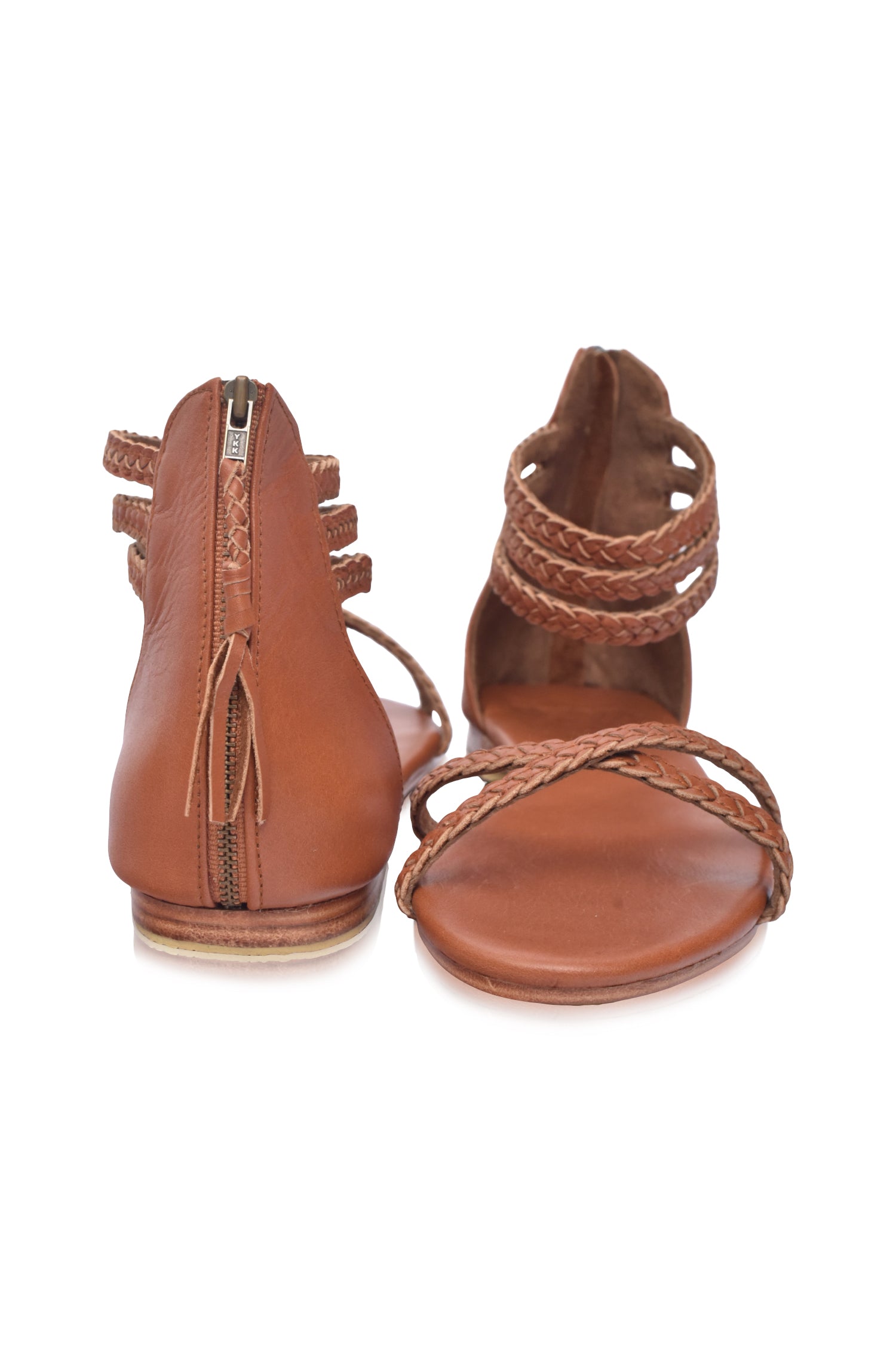 Calypso Braided Leather Sandals featuring braided leather straps and a zipper closure, perfect for summer wear.