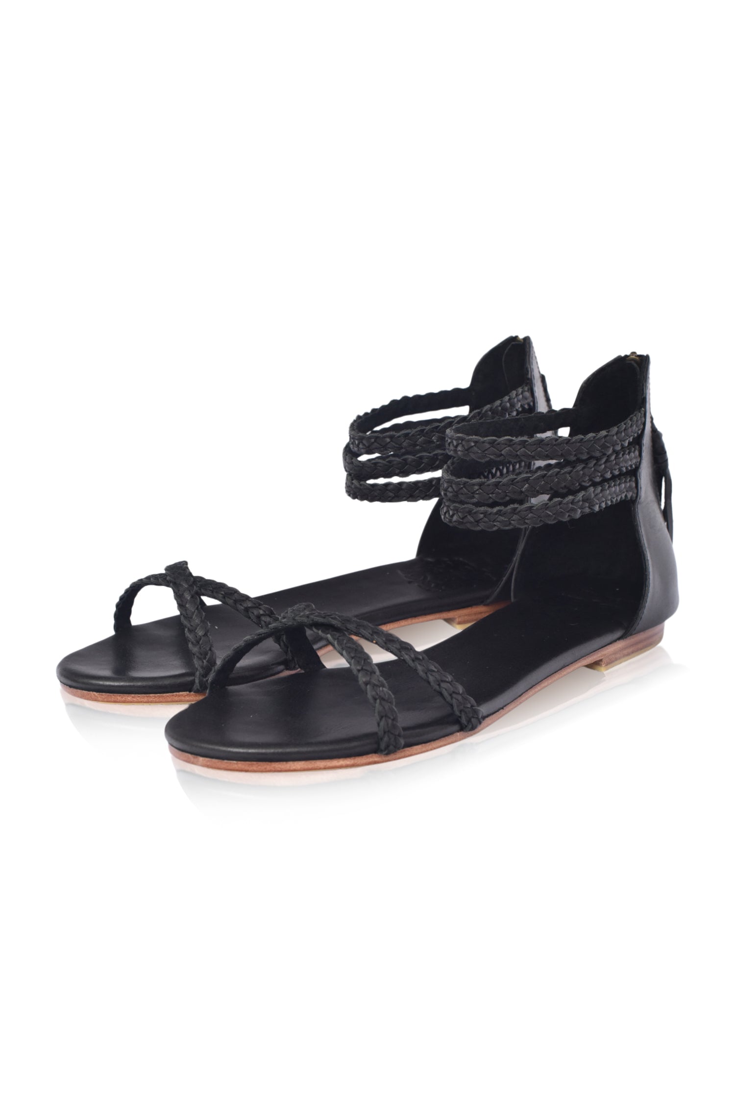 Calypso Braided Leather Sandals featuring braided leather straps and a zipper closure, perfect for summer wear.