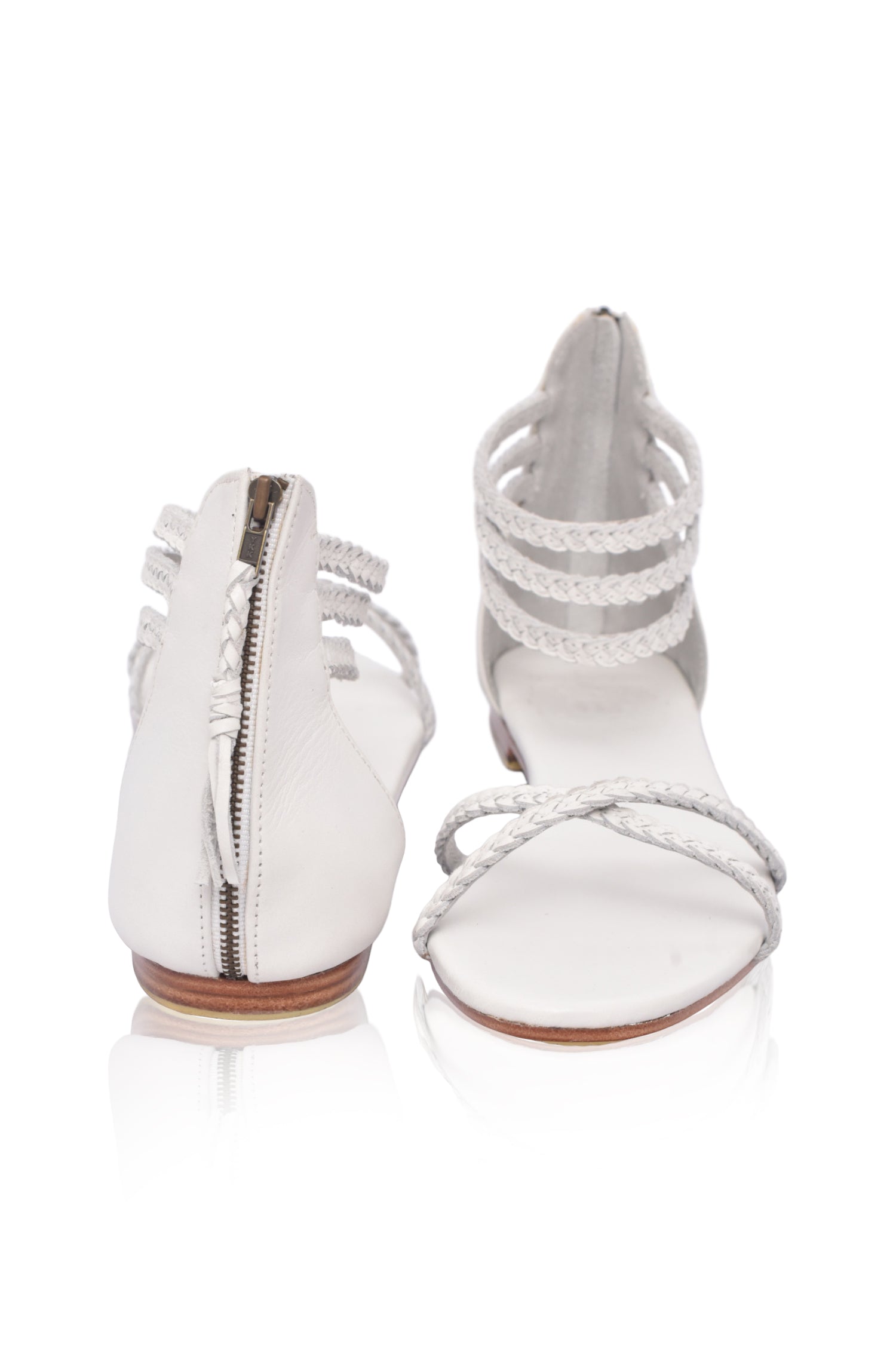 Calypso Braided Leather Sandals featuring braided leather straps and a zipper closure, perfect for summer wear.