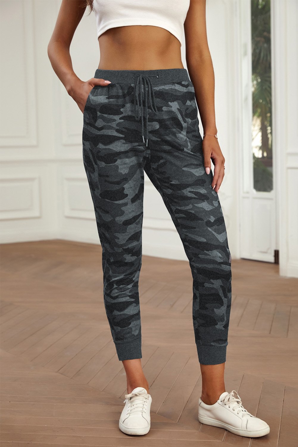 A pair of stylish camouflage drawstring joggers featuring an elastic waistband and side pockets, perfect for workouts and casual wear.