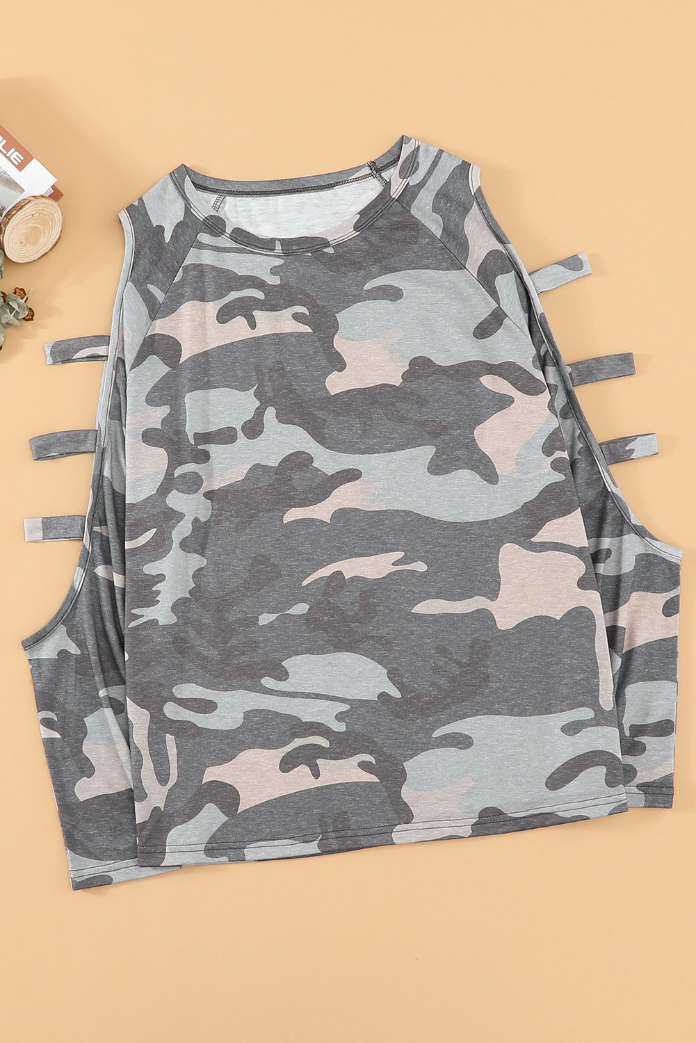 A stylish camouflage long sleeve top featuring hollow-out shoulders, perfect for casual wear.