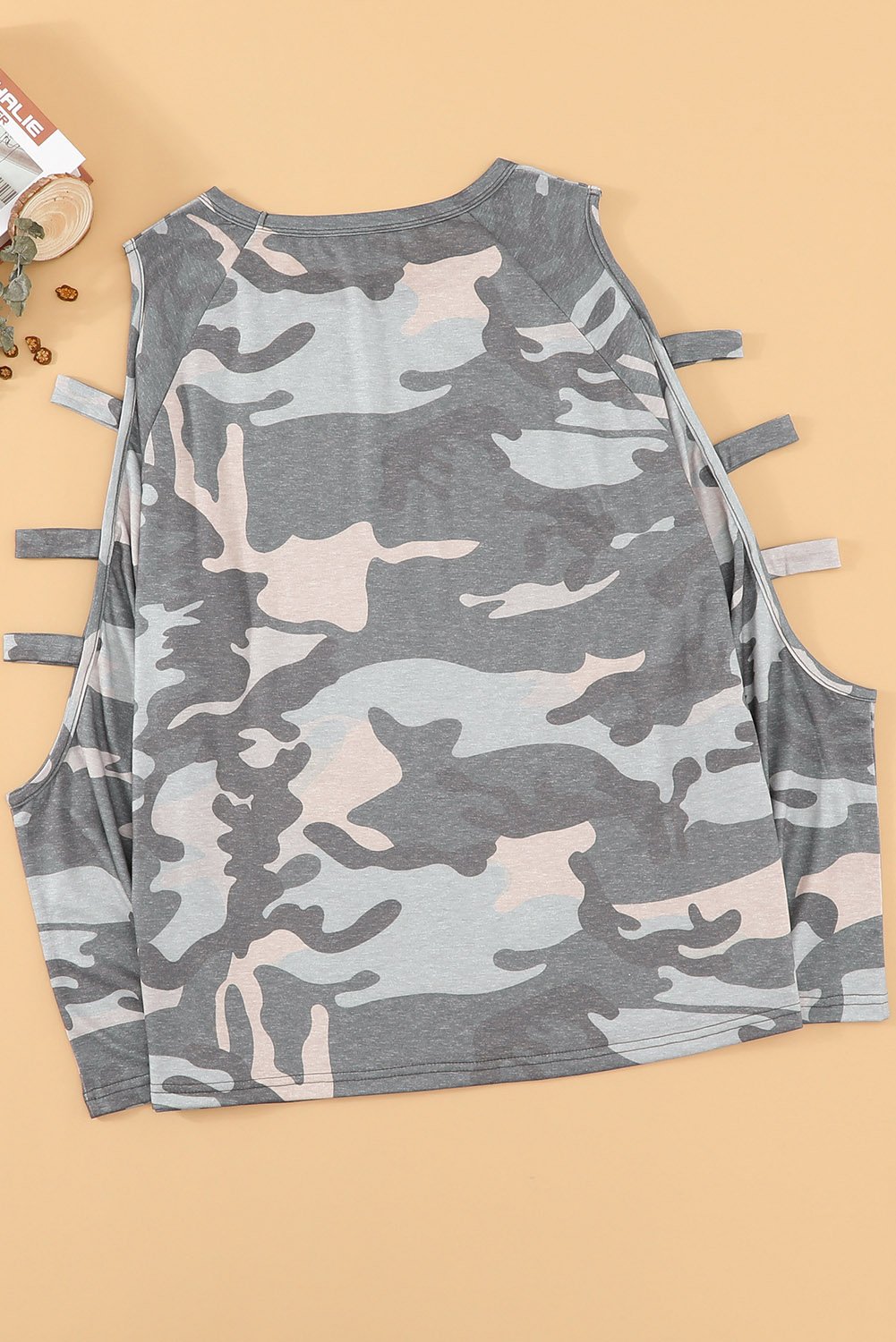A stylish camouflage long sleeve top featuring hollow-out shoulders, perfect for casual wear.