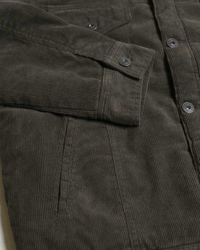 Casual Corduroy Lined Trucker Jacket in Dark Olive with Borg collar and pockets, showcasing its stylish design and warm sherpa lining.