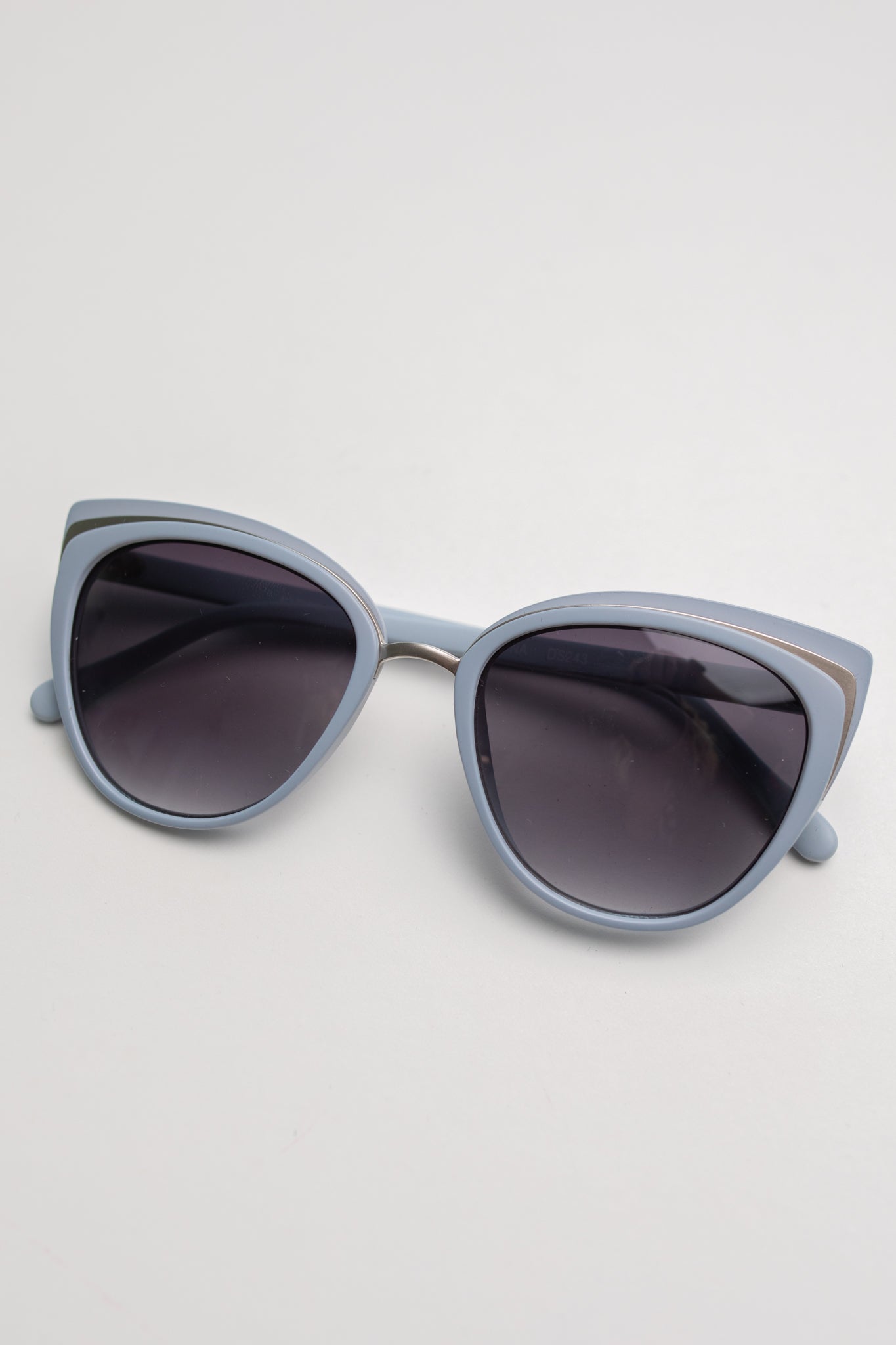 A pair of stylish Cat Eye Sunglasses in blue, showcasing a modern retro design with UV protection.