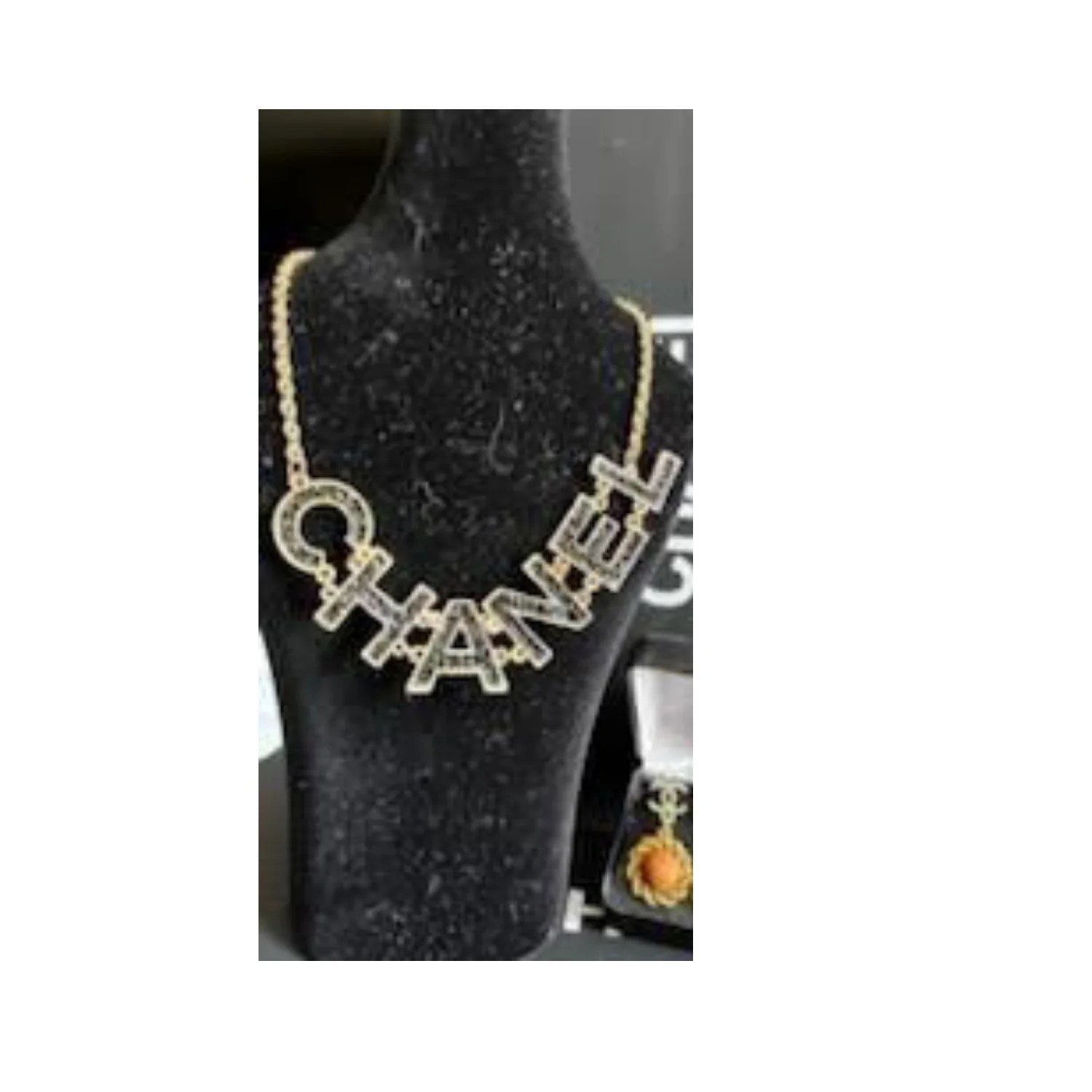 Charming Women Necklace featuring a luxurious gold CC pendant, elegantly designed for women.