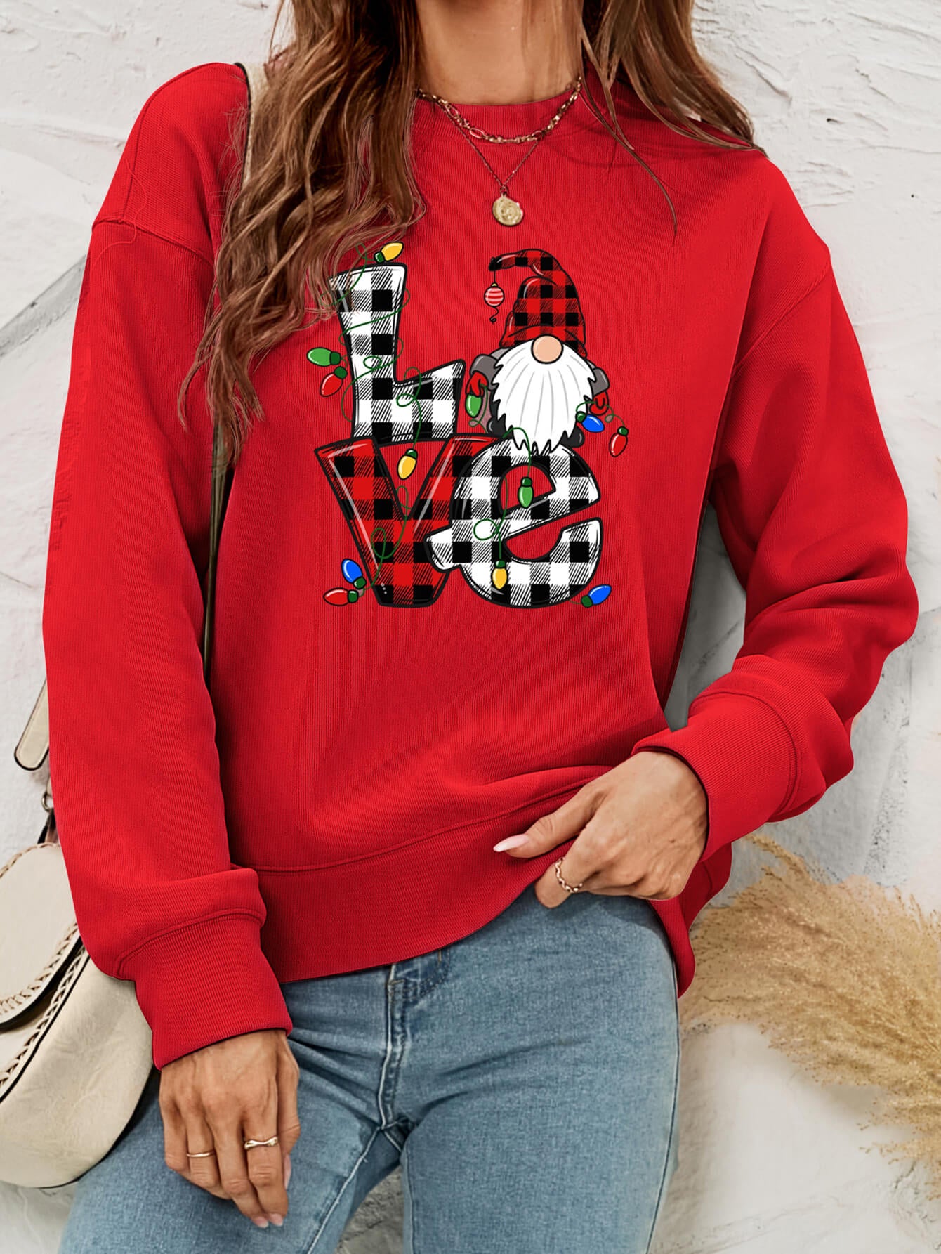 A cozy Christmas Plaid Graphic Dropped Shoulder Sweatshirt featuring a festive plaid design, long sleeves, and a relaxed fit.