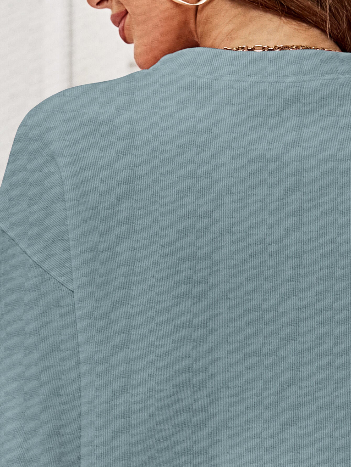 A cozy Christmas Plaid Graphic Dropped Shoulder Sweatshirt featuring a festive plaid design, long sleeves, and a relaxed fit.