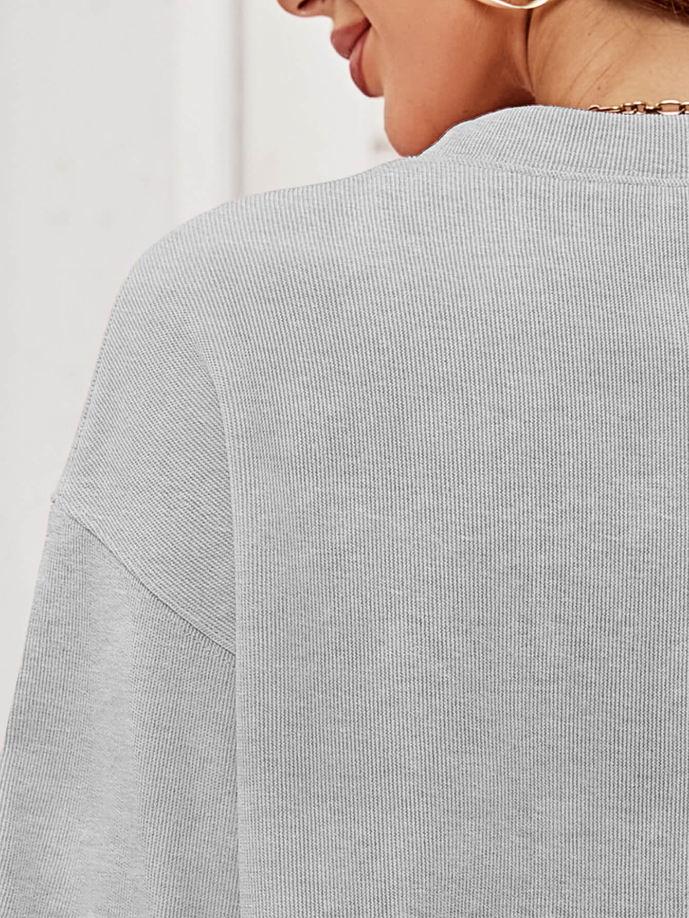 A cozy Christmas Plaid Graphic Dropped Shoulder Sweatshirt featuring a festive plaid design, long sleeves, and a relaxed fit.