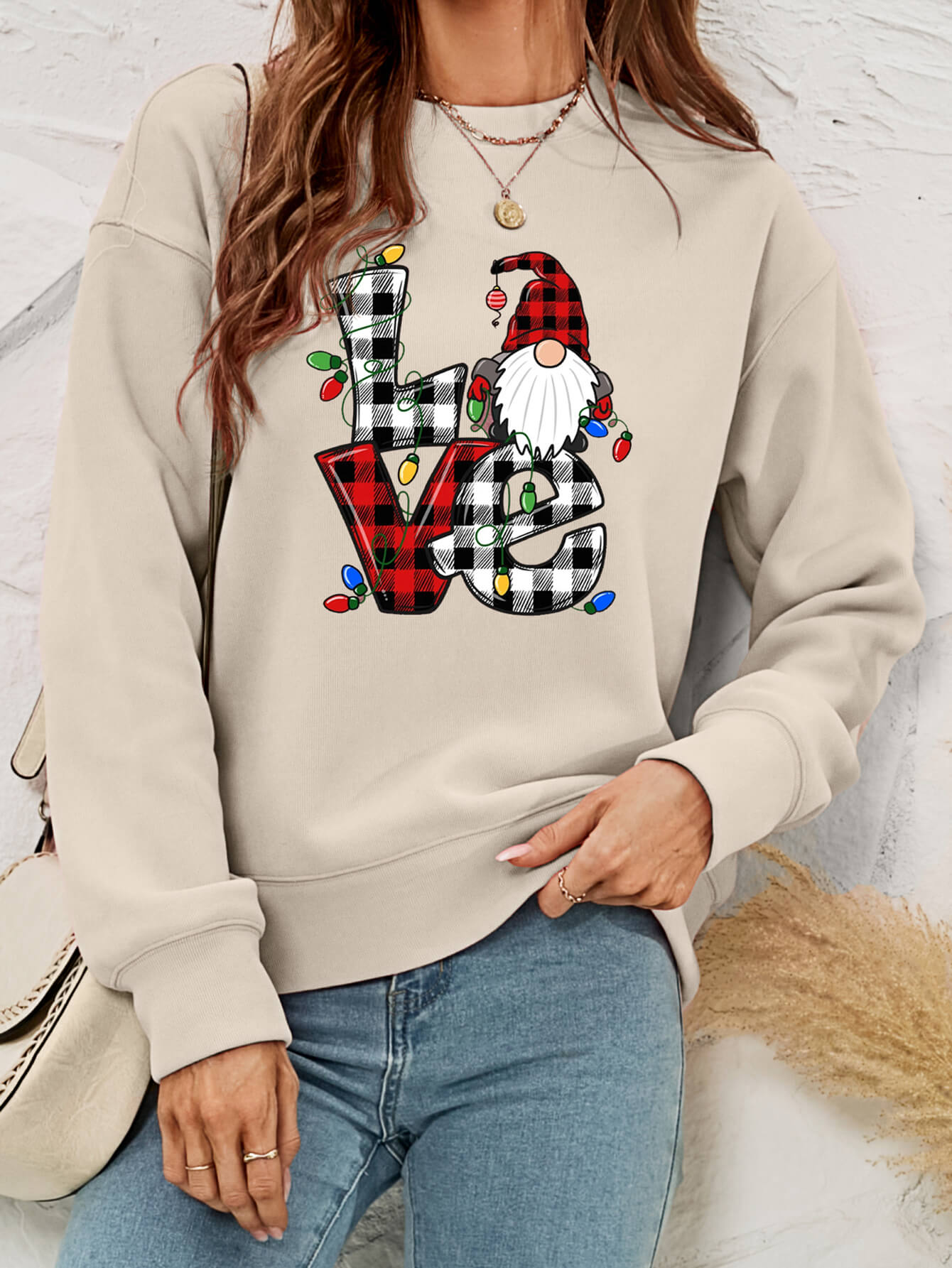 A cozy Christmas Plaid Graphic Dropped Shoulder Sweatshirt featuring a festive plaid design, long sleeves, and a relaxed fit.