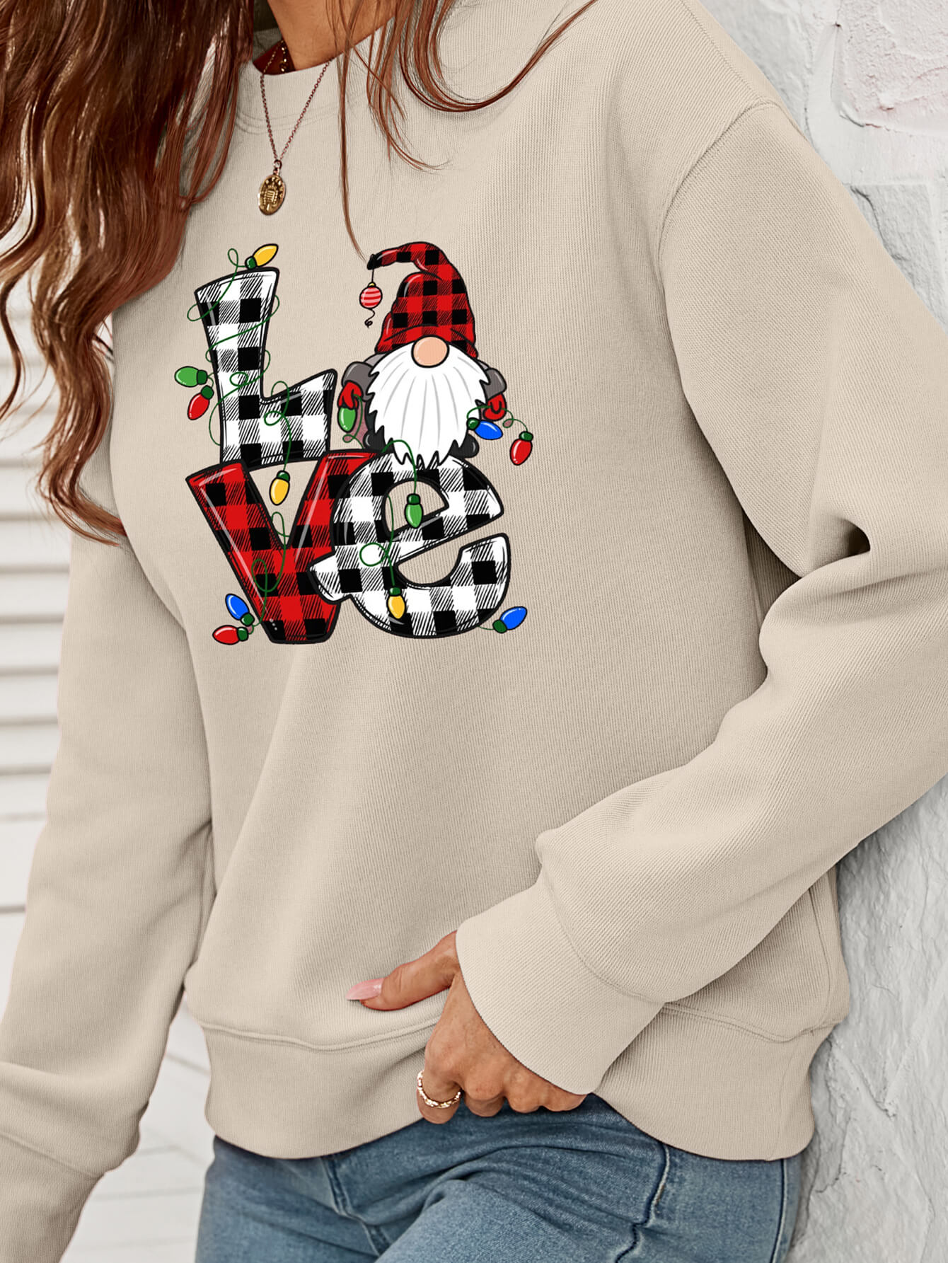 A cozy Christmas Plaid Graphic Dropped Shoulder Sweatshirt featuring a festive plaid design, long sleeves, and a relaxed fit.