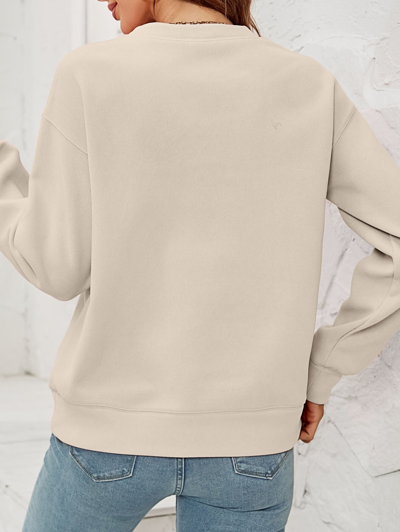 A cozy Christmas Plaid Graphic Dropped Shoulder Sweatshirt featuring a festive plaid design, long sleeves, and a relaxed fit.