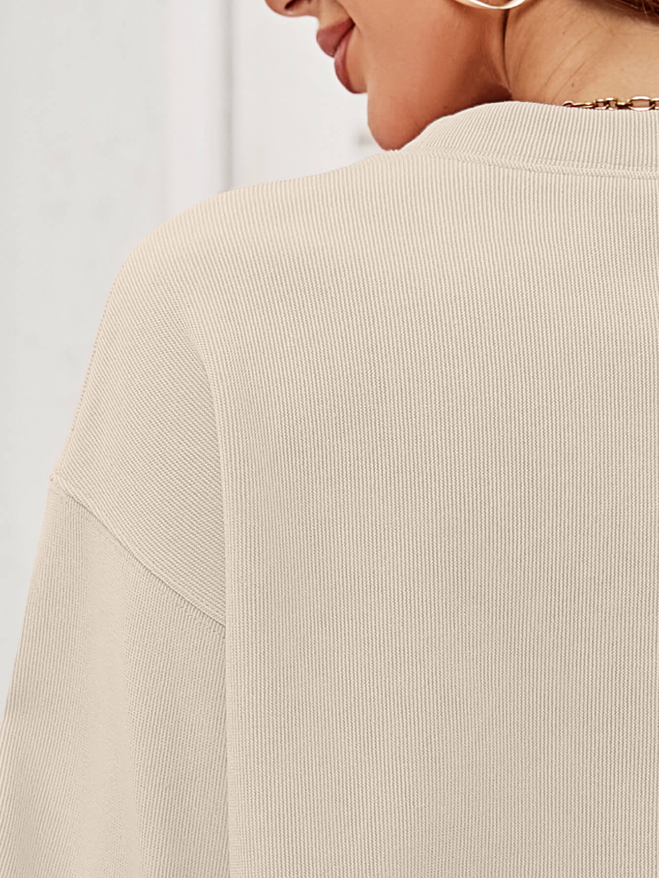 A cozy Christmas Plaid Graphic Dropped Shoulder Sweatshirt featuring a festive plaid design, long sleeves, and a relaxed fit.