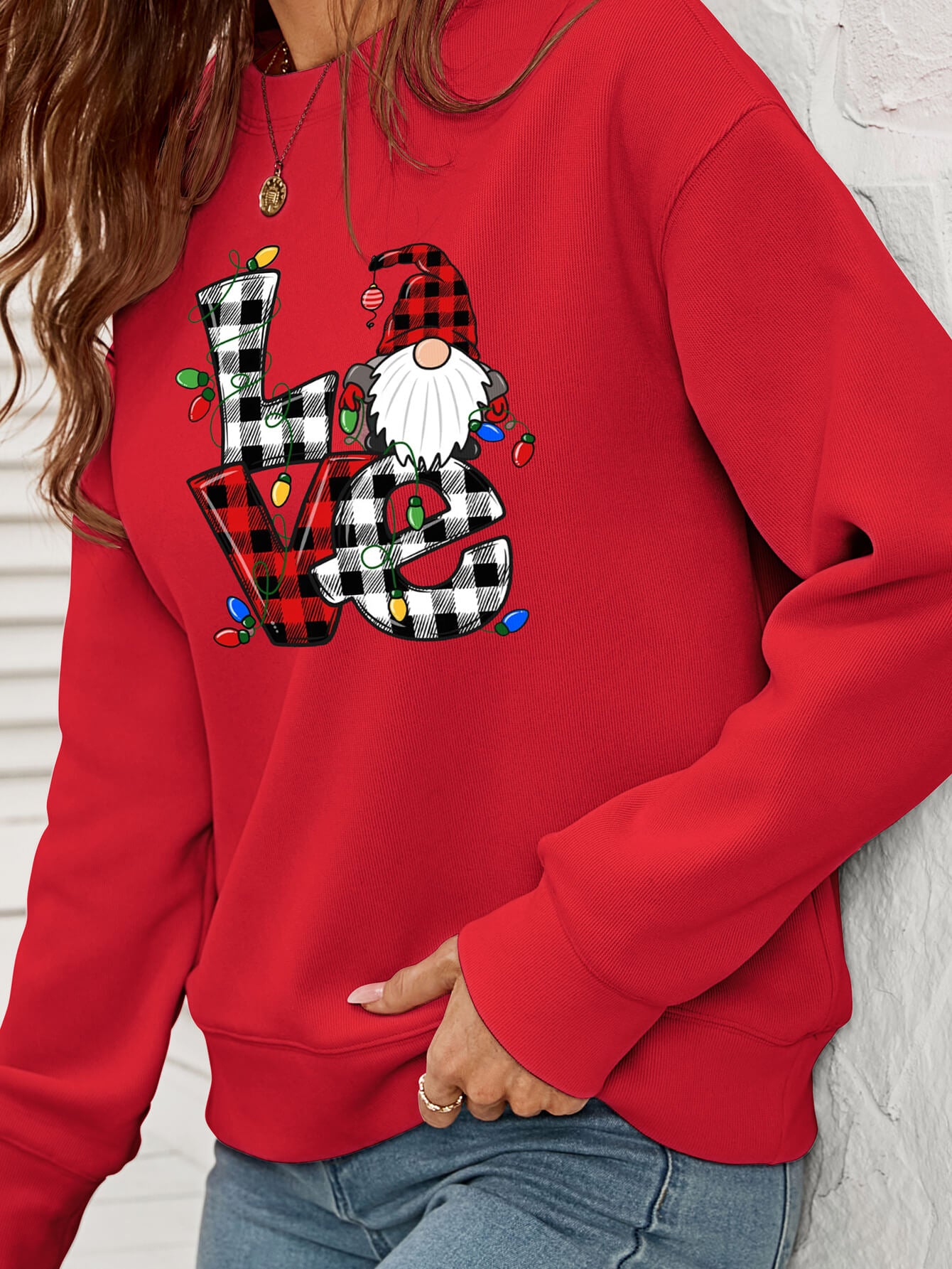 A cozy Christmas Plaid Graphic Dropped Shoulder Sweatshirt featuring a festive plaid design, long sleeves, and a relaxed fit.