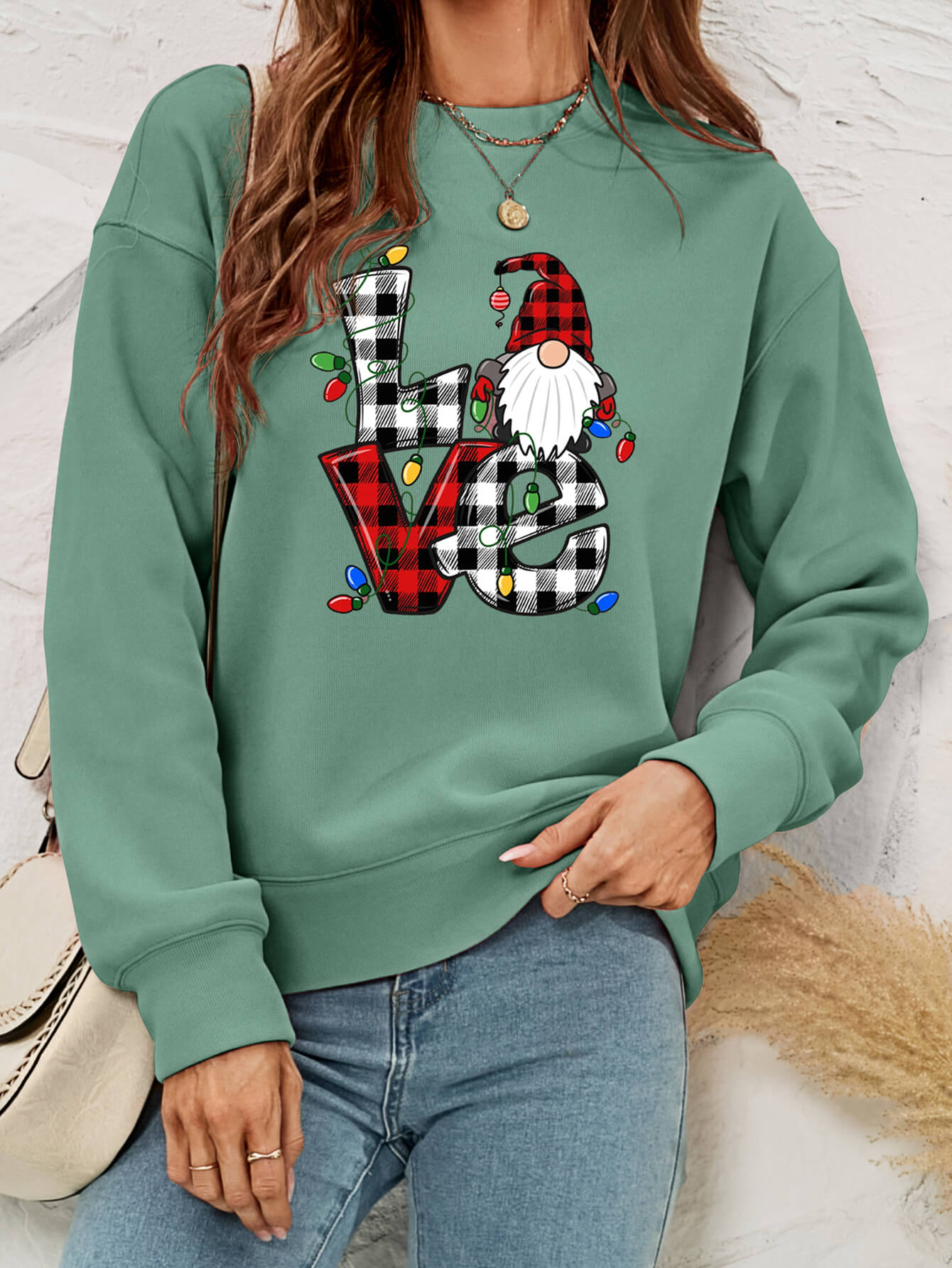 A cozy Christmas Plaid Graphic Dropped Shoulder Sweatshirt featuring a festive plaid design, long sleeves, and a relaxed fit.