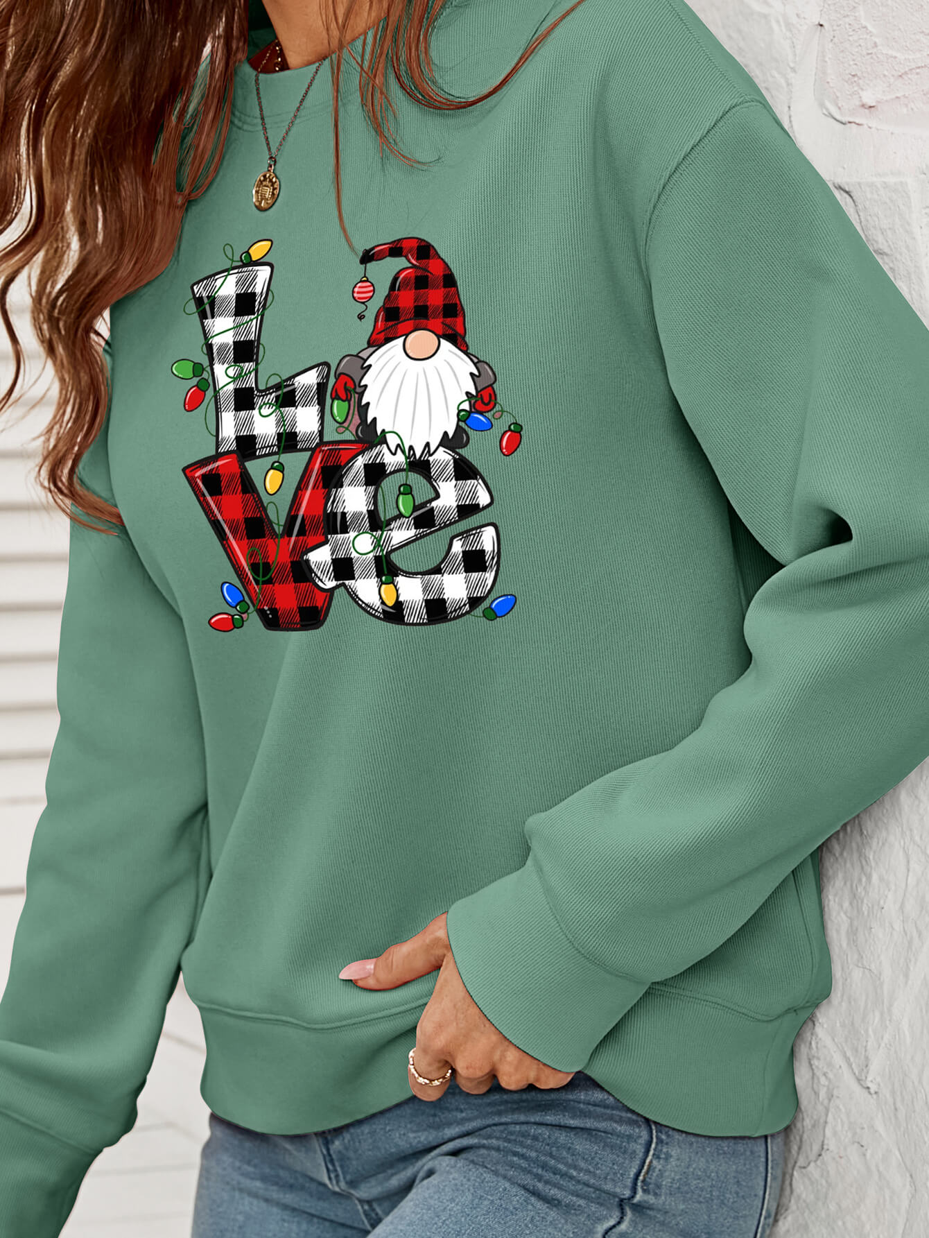 A cozy Christmas Plaid Graphic Dropped Shoulder Sweatshirt featuring a festive plaid design, long sleeves, and a relaxed fit.