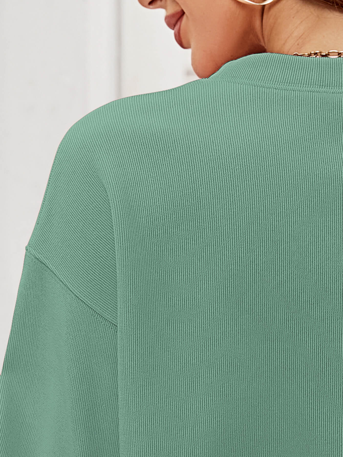 A cozy Christmas Plaid Graphic Dropped Shoulder Sweatshirt featuring a festive plaid design, long sleeves, and a relaxed fit.