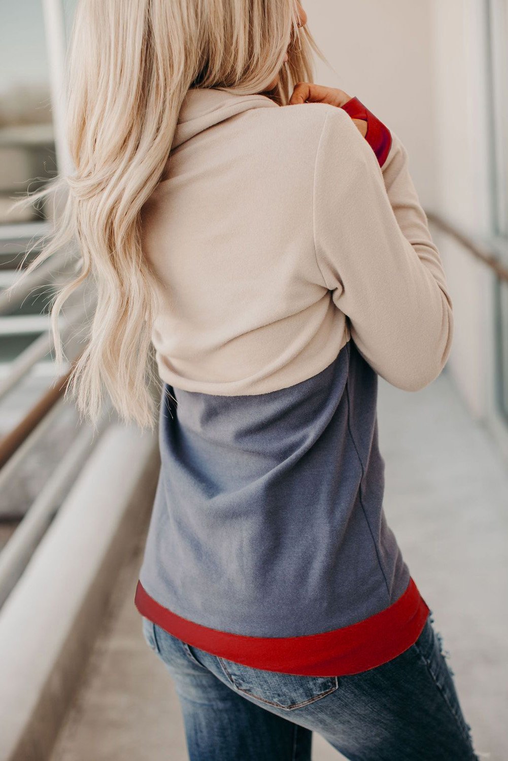 A vibrant Christmas Print Hoodie featuring a colorful block design and a charming elk print, complete with trendy thumb holes for added warmth.