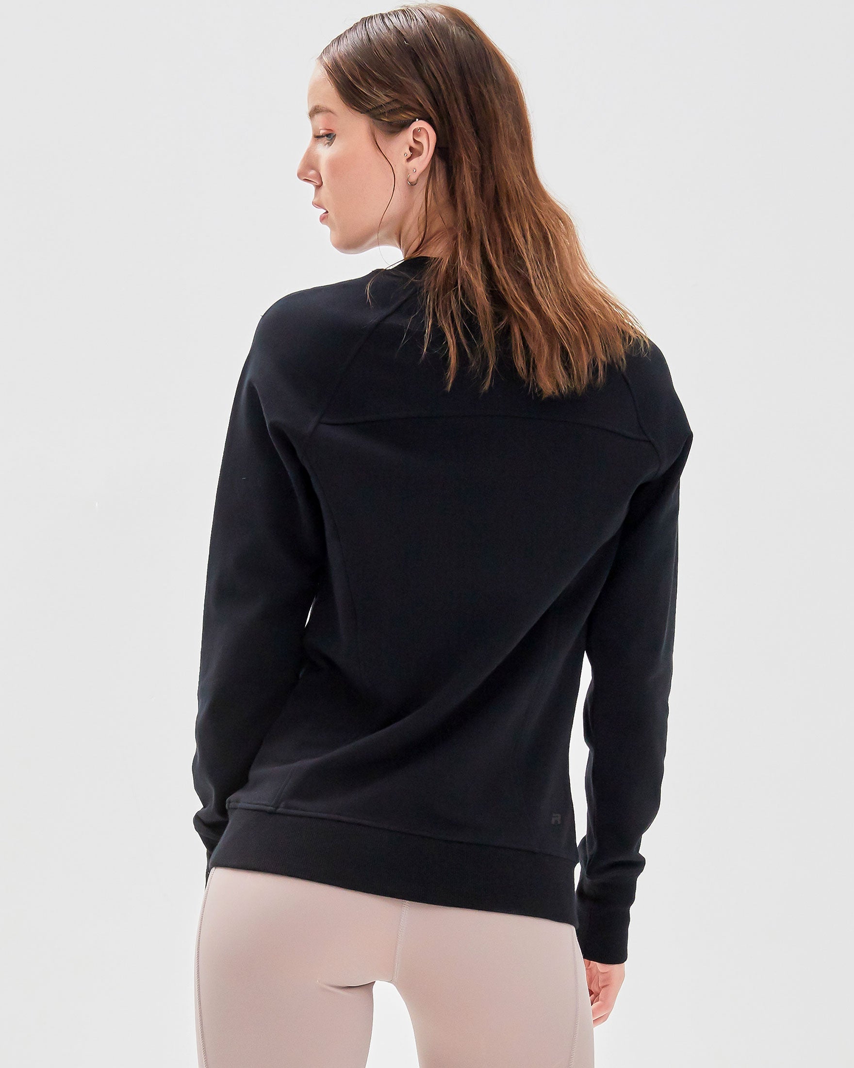 City Zip Slim Crewneck sweatshirt in modern fitted style, featuring ribbed cuffs and hidden zipper seams, perfect for active lifestyles.