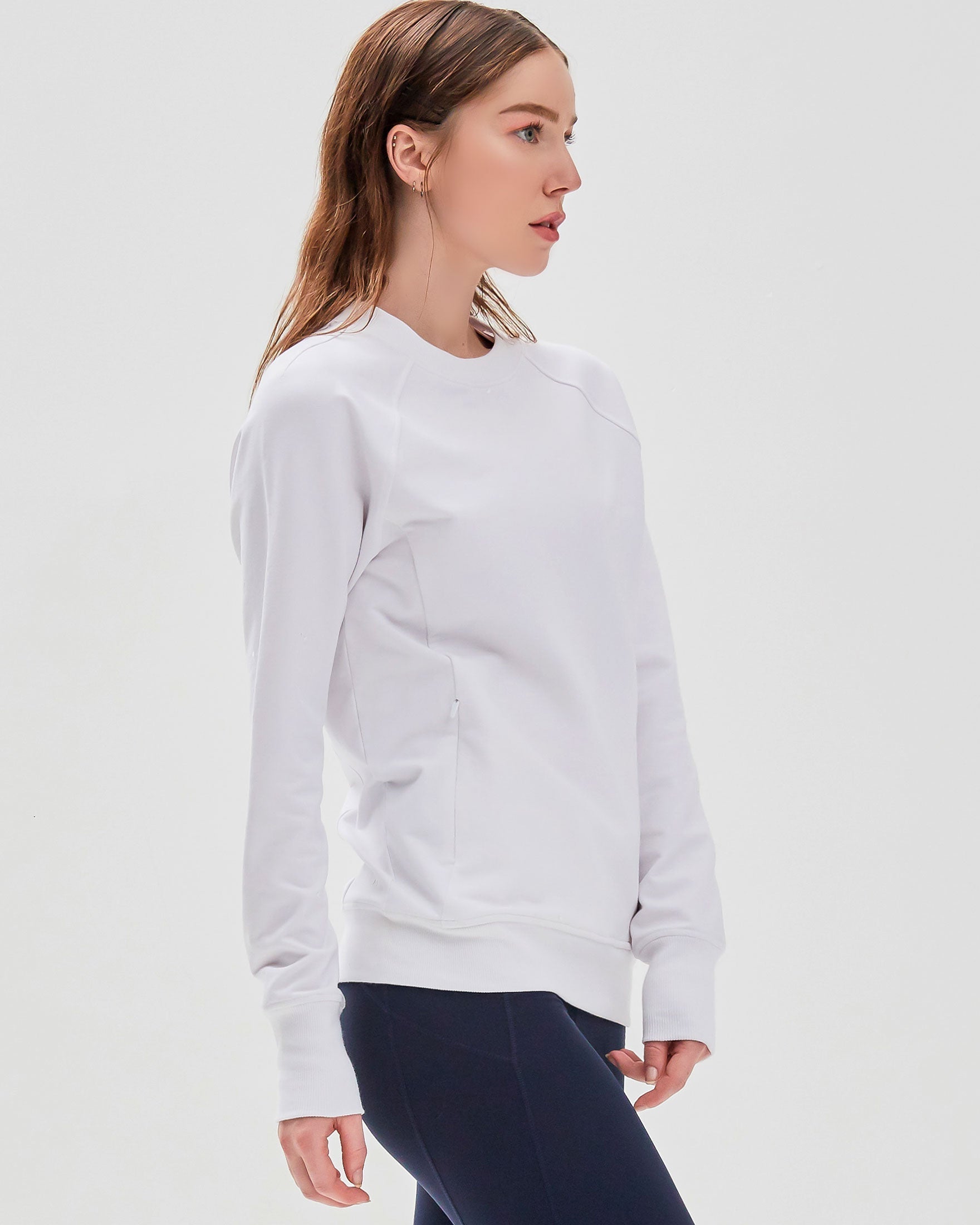 City Zip Slim Crewneck sweatshirt in modern fitted style, featuring ribbed cuffs and hidden zipper seams, perfect for active lifestyles.