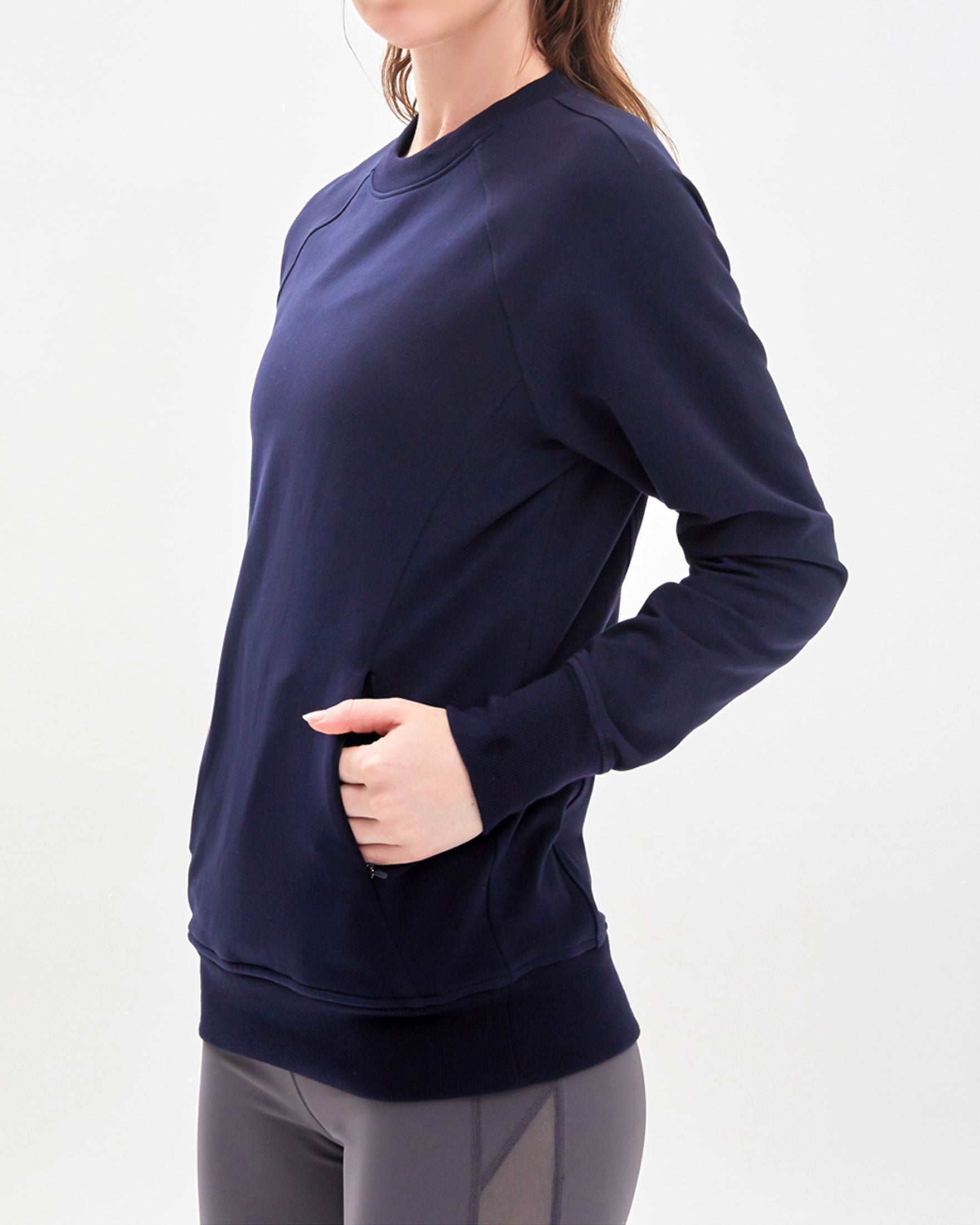 City Zip Slim Crewneck sweatshirt in modern fitted style, featuring ribbed cuffs and hidden zipper seams, perfect for active lifestyles.