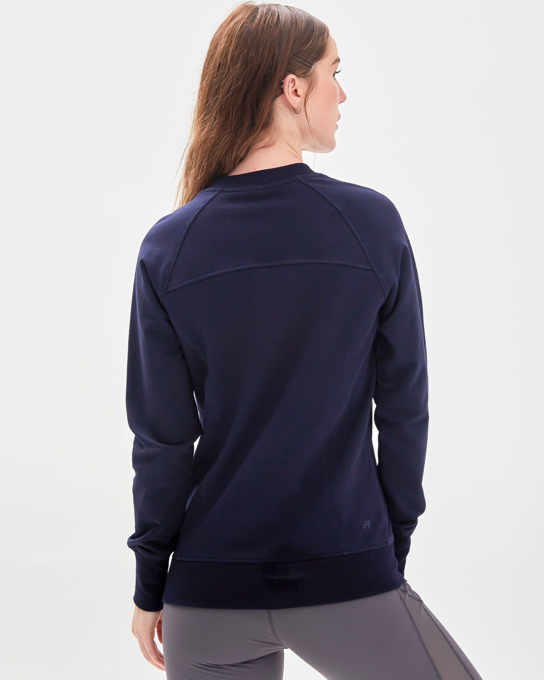 City Zip Slim Crewneck sweatshirt in modern fitted style, featuring ribbed cuffs and hidden zipper seams, perfect for active lifestyles.
