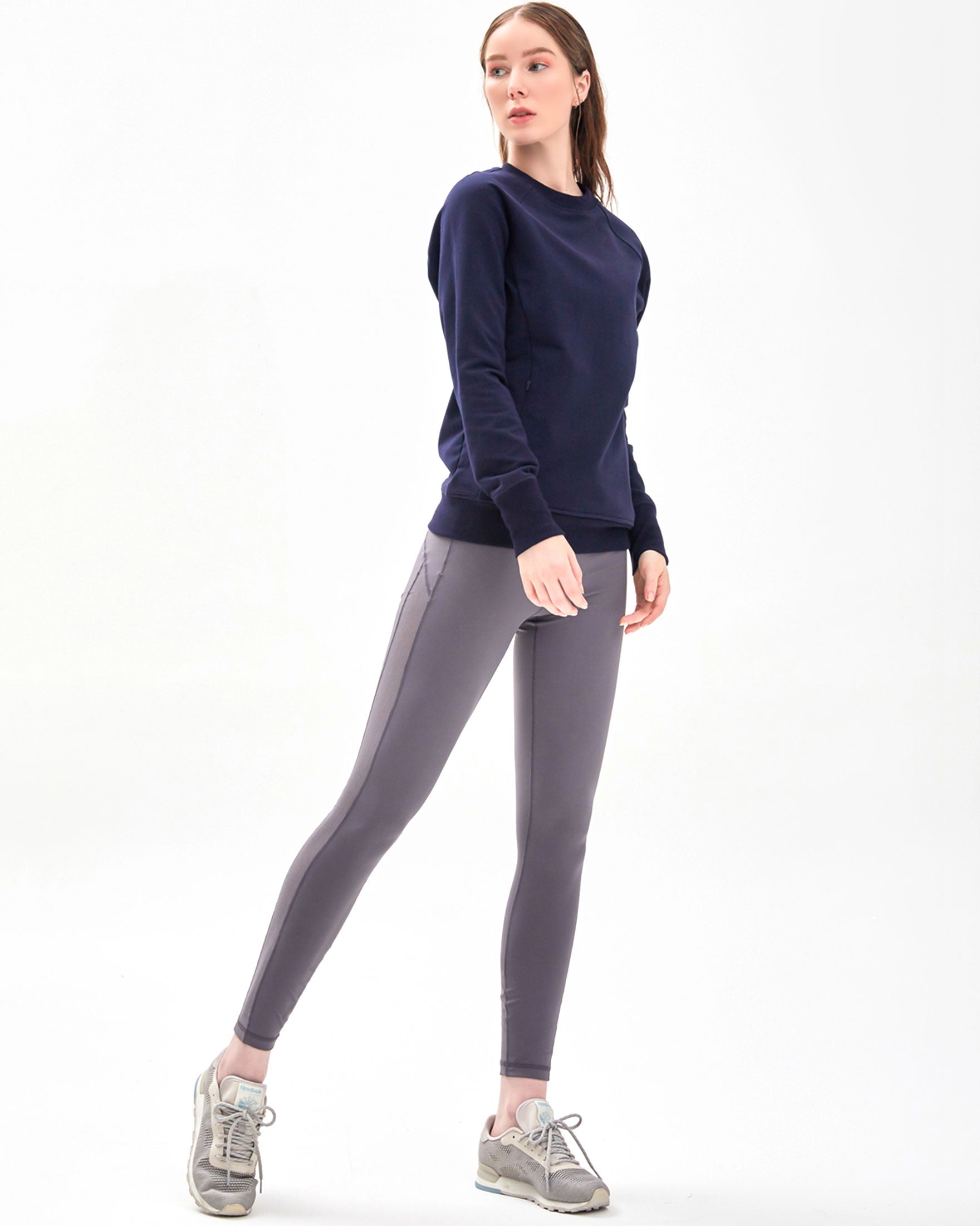 City Zip Slim Crewneck sweatshirt in modern fitted style, featuring ribbed cuffs and hidden zipper seams, perfect for active lifestyles.