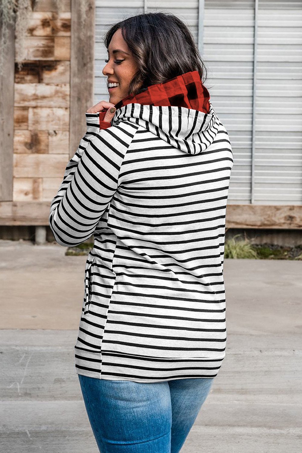 Classic striped hoodie with pocket, showcasing its soft fabric and casual style, perfect for everyday wear.